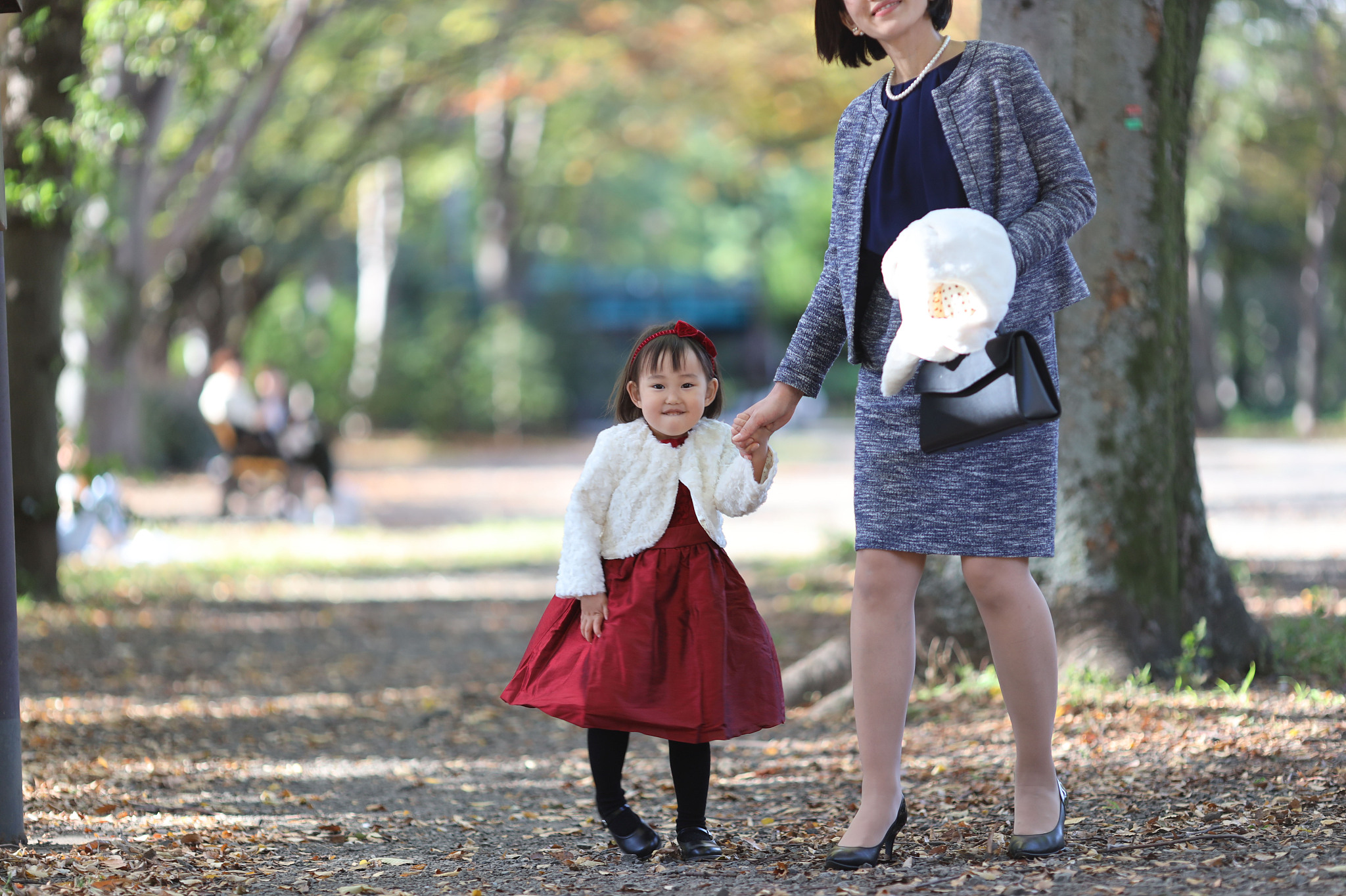 japanese mother walking  with her daughter at shichi go san cele