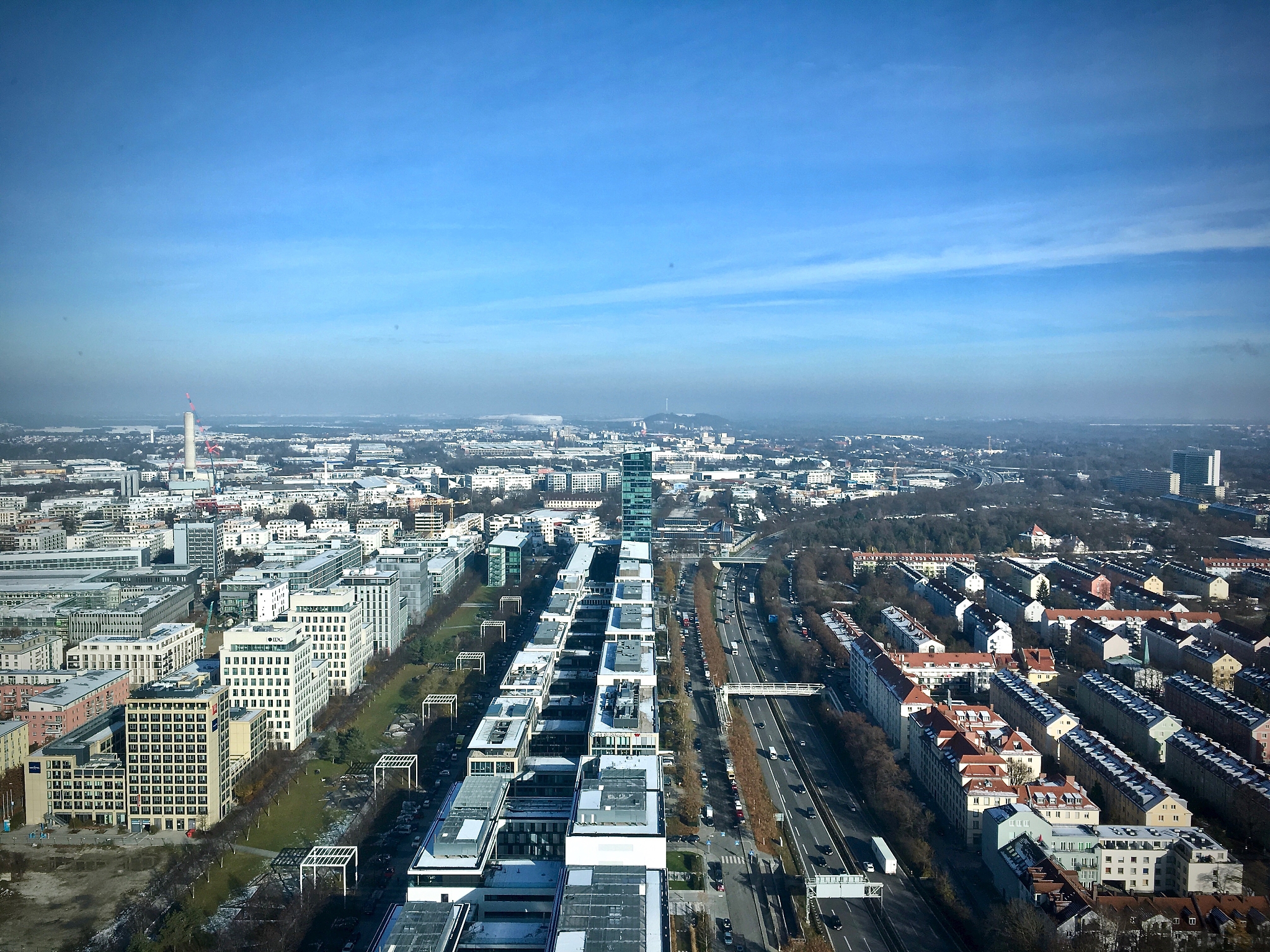 high angle view of city and buildings against blue sky