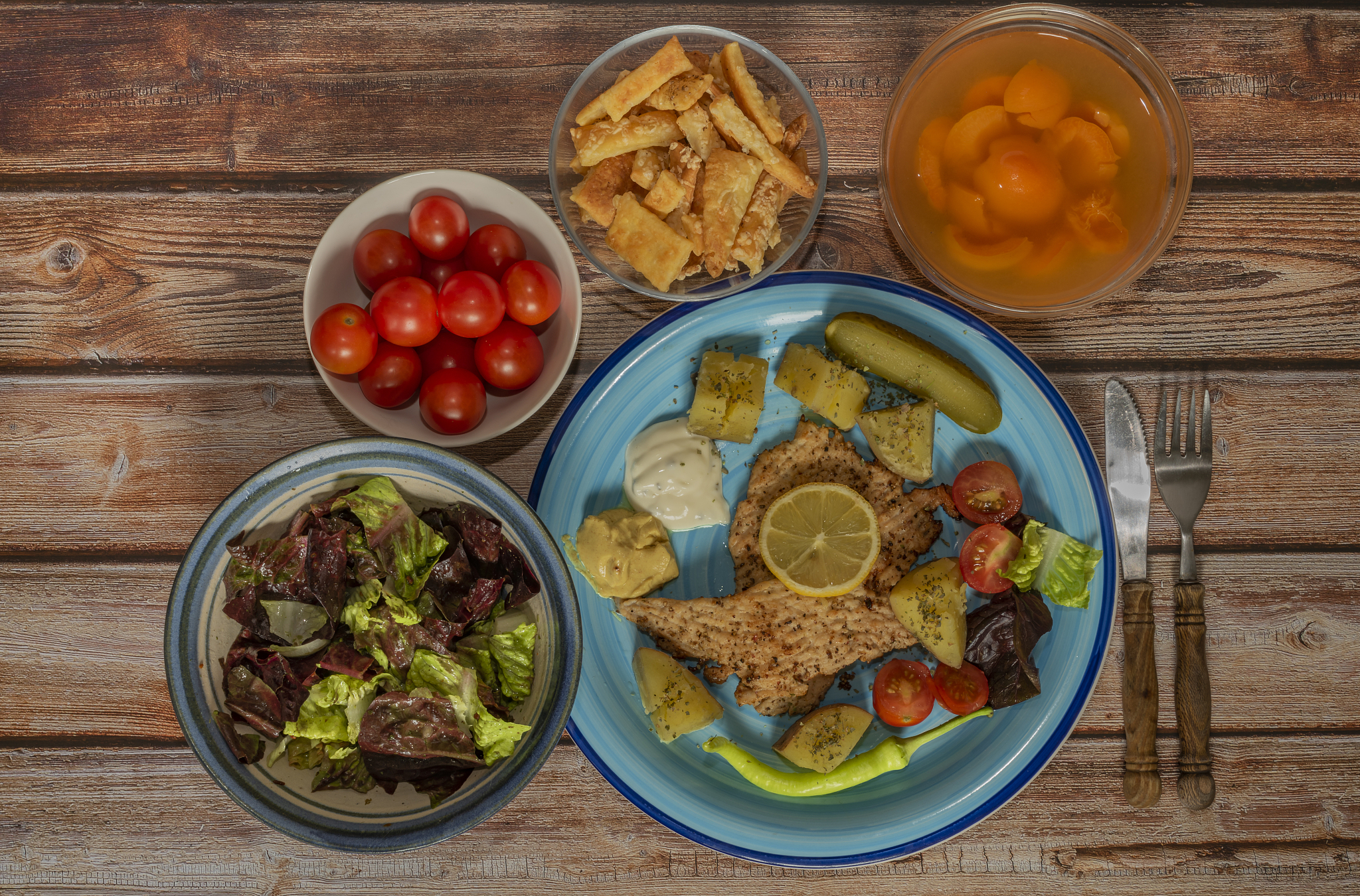 vegetable fruit yoghurt apricot courgette chicken on blue plate 