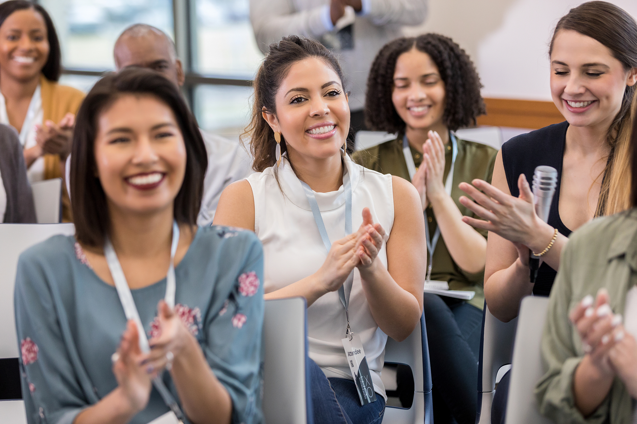business people applaud during conference