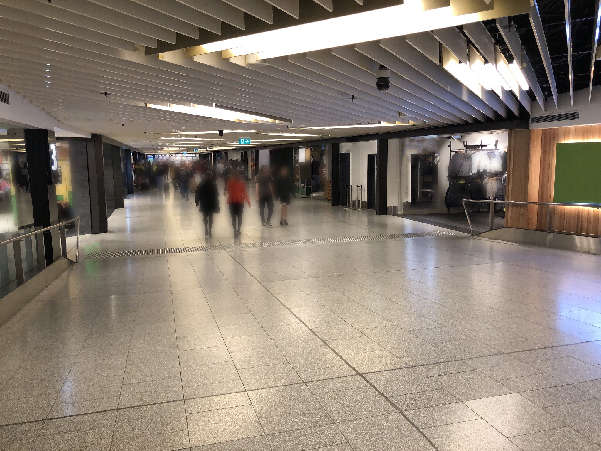 anonymous blurred people in transit at the airport