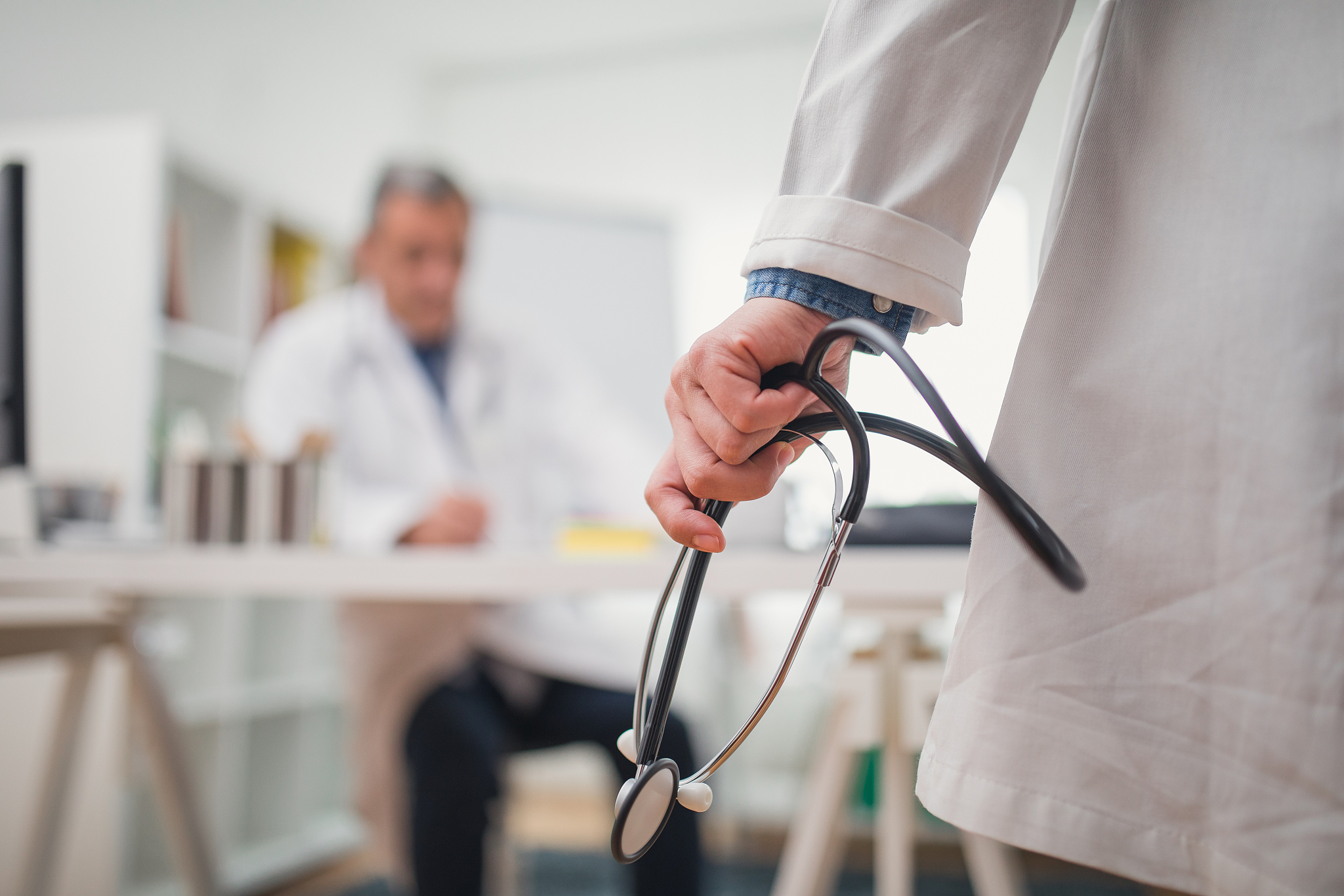 doctor holding stethoscope