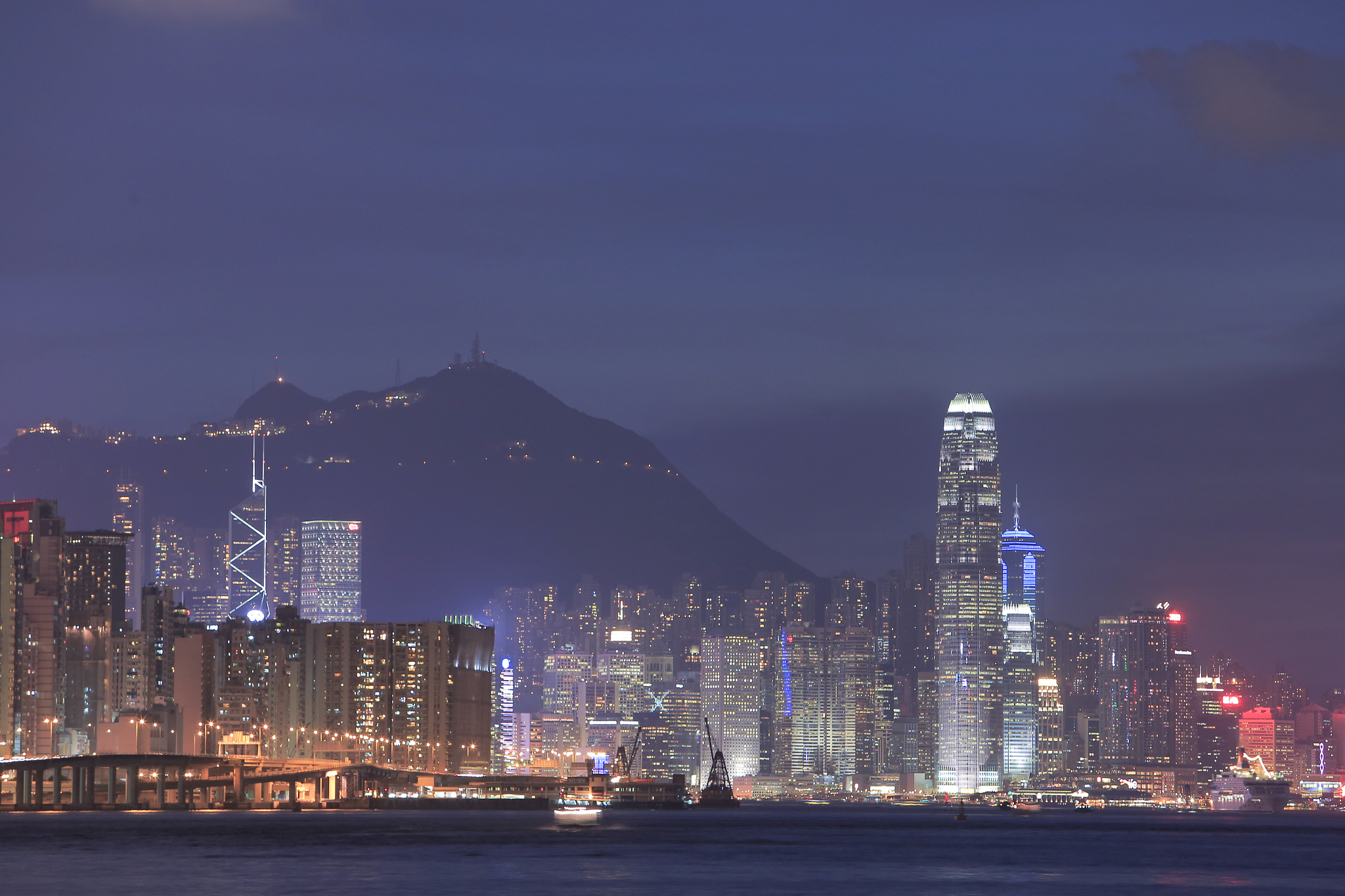 victoria harbor of hong kong city at dusk 2014
