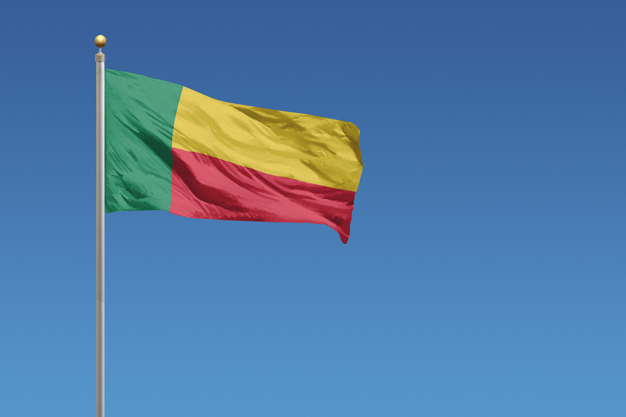 national flag of benin on a clear blue sky