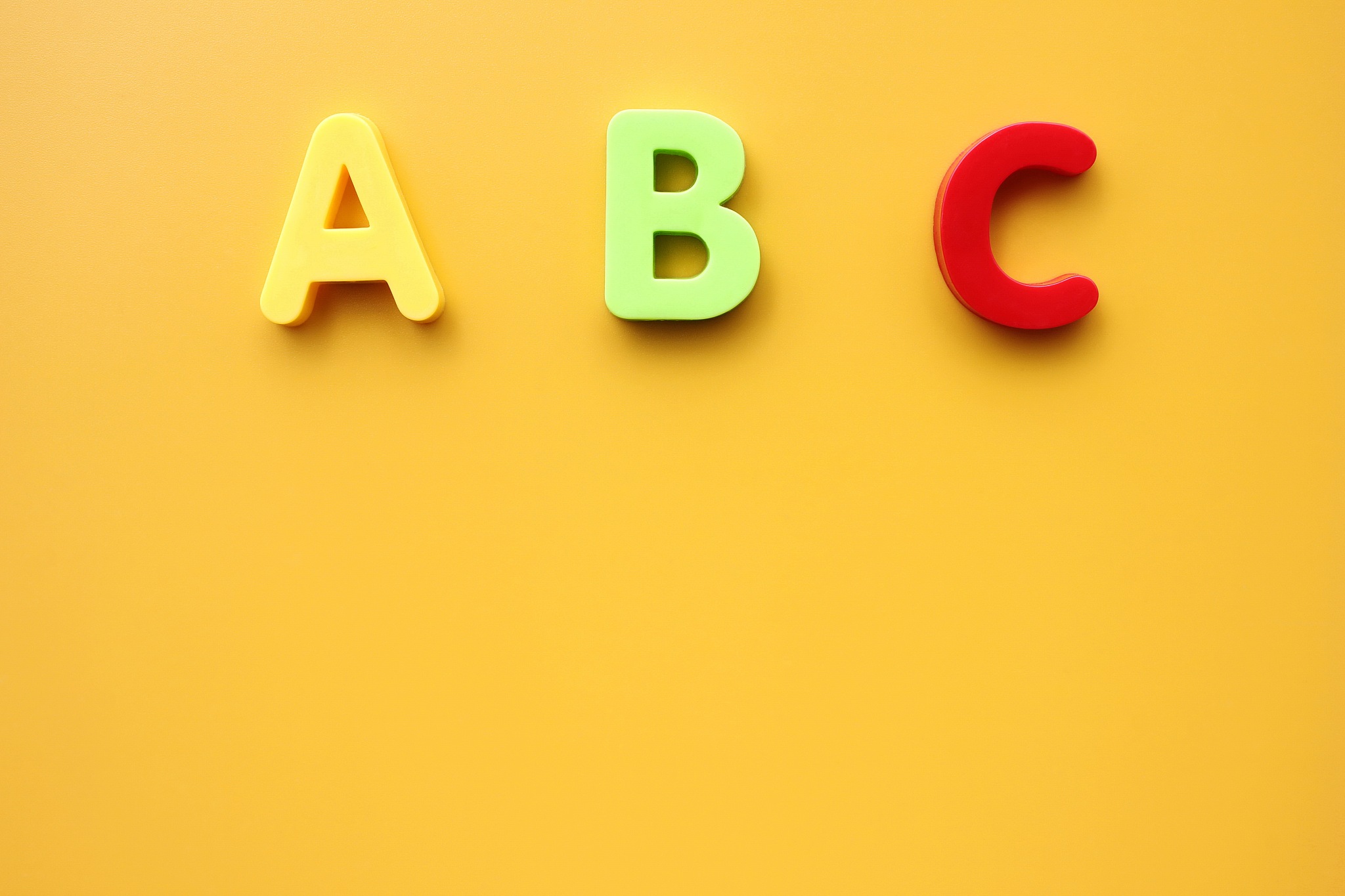 abc first letters of the english alphabet on a yellow background