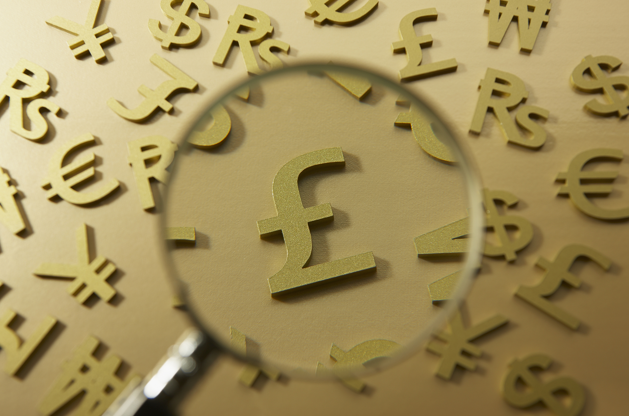 magnifying glass on pond symbol.