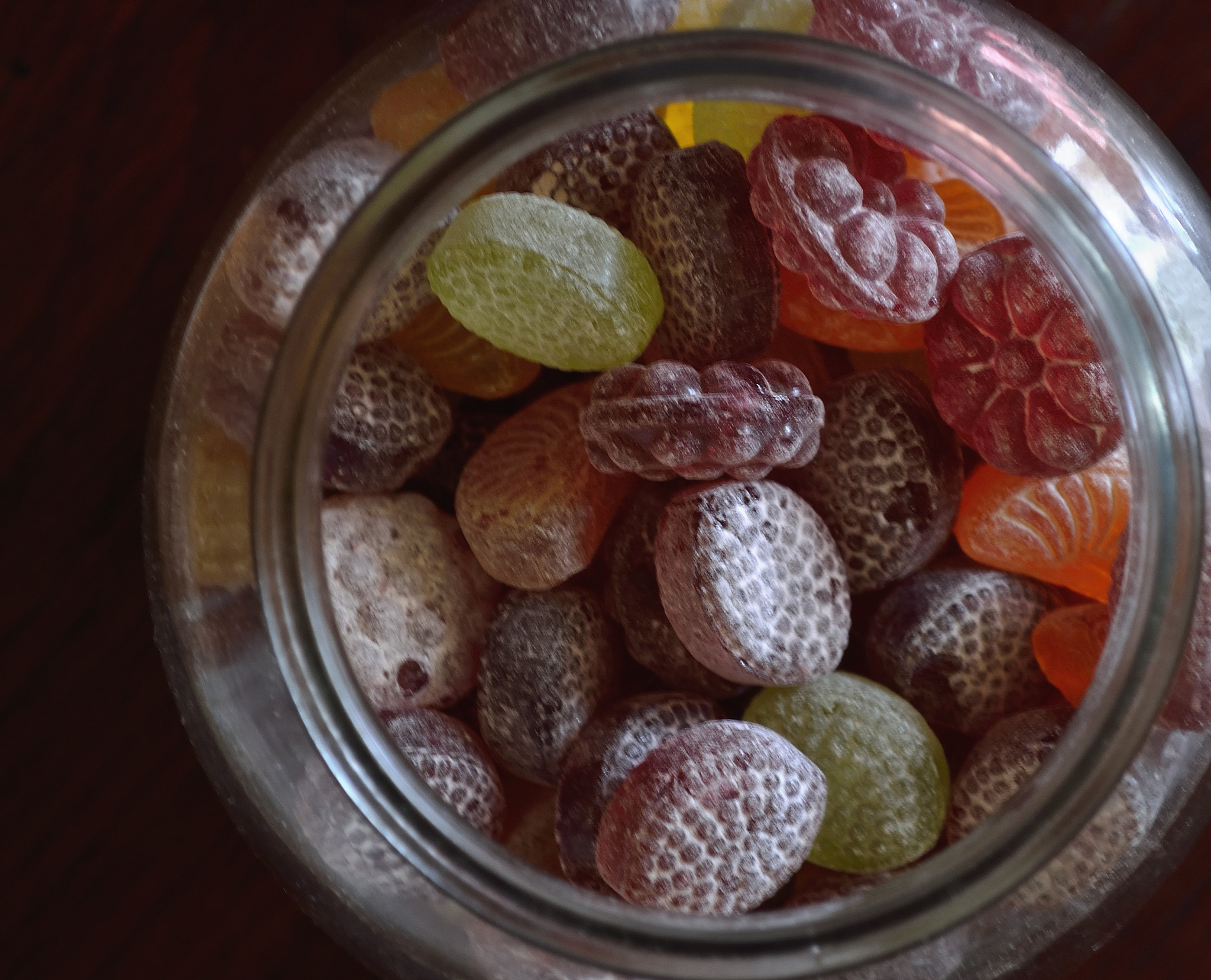 fruit shaped hard candy in glass jar