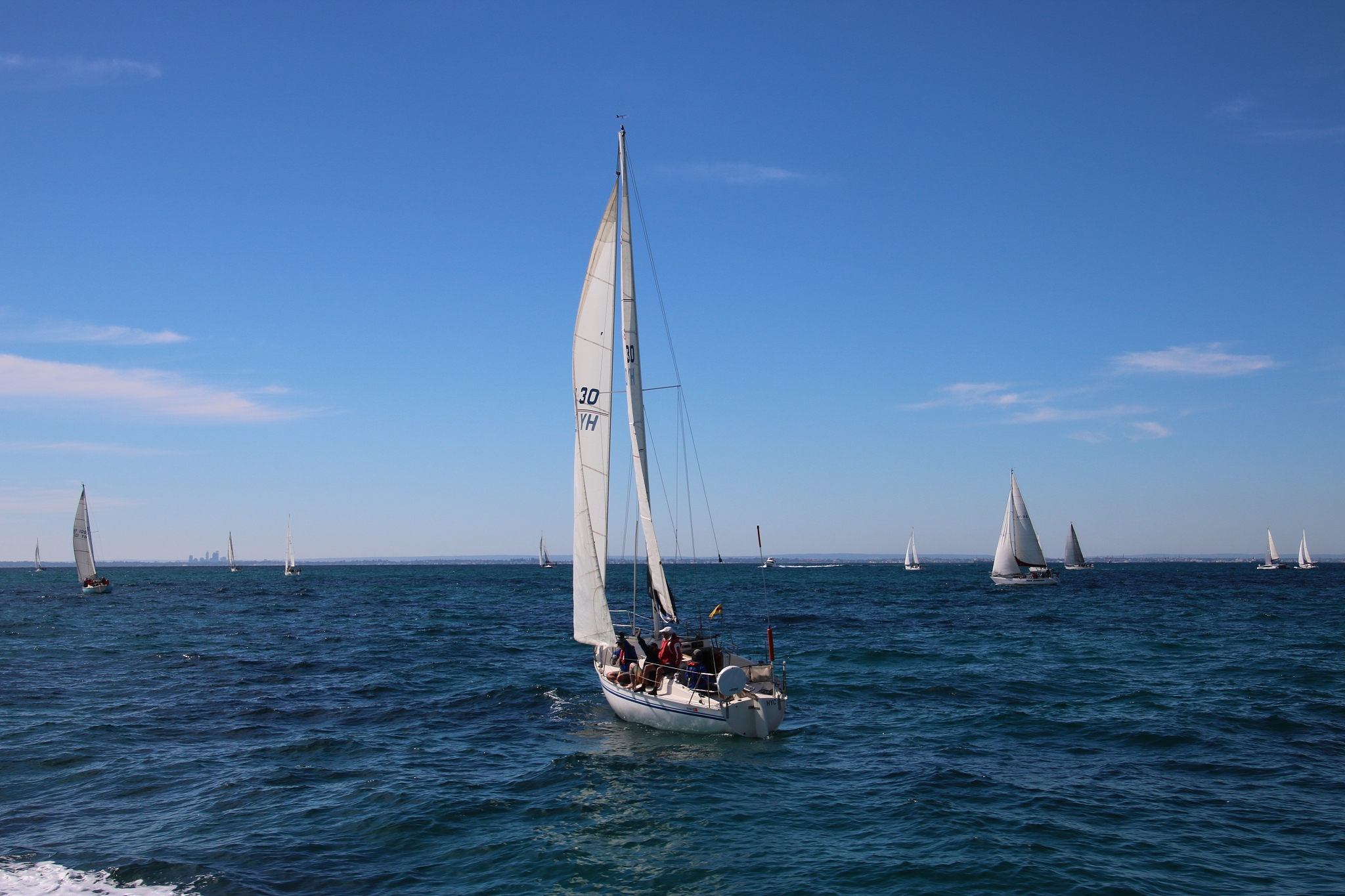 sailboat sailing on sea against sky