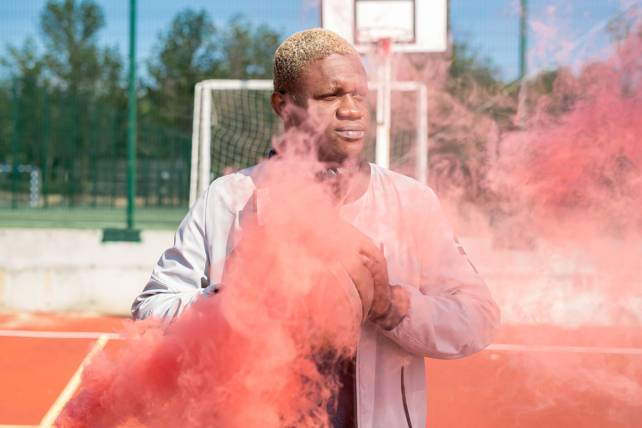 african basketball player in red smoke