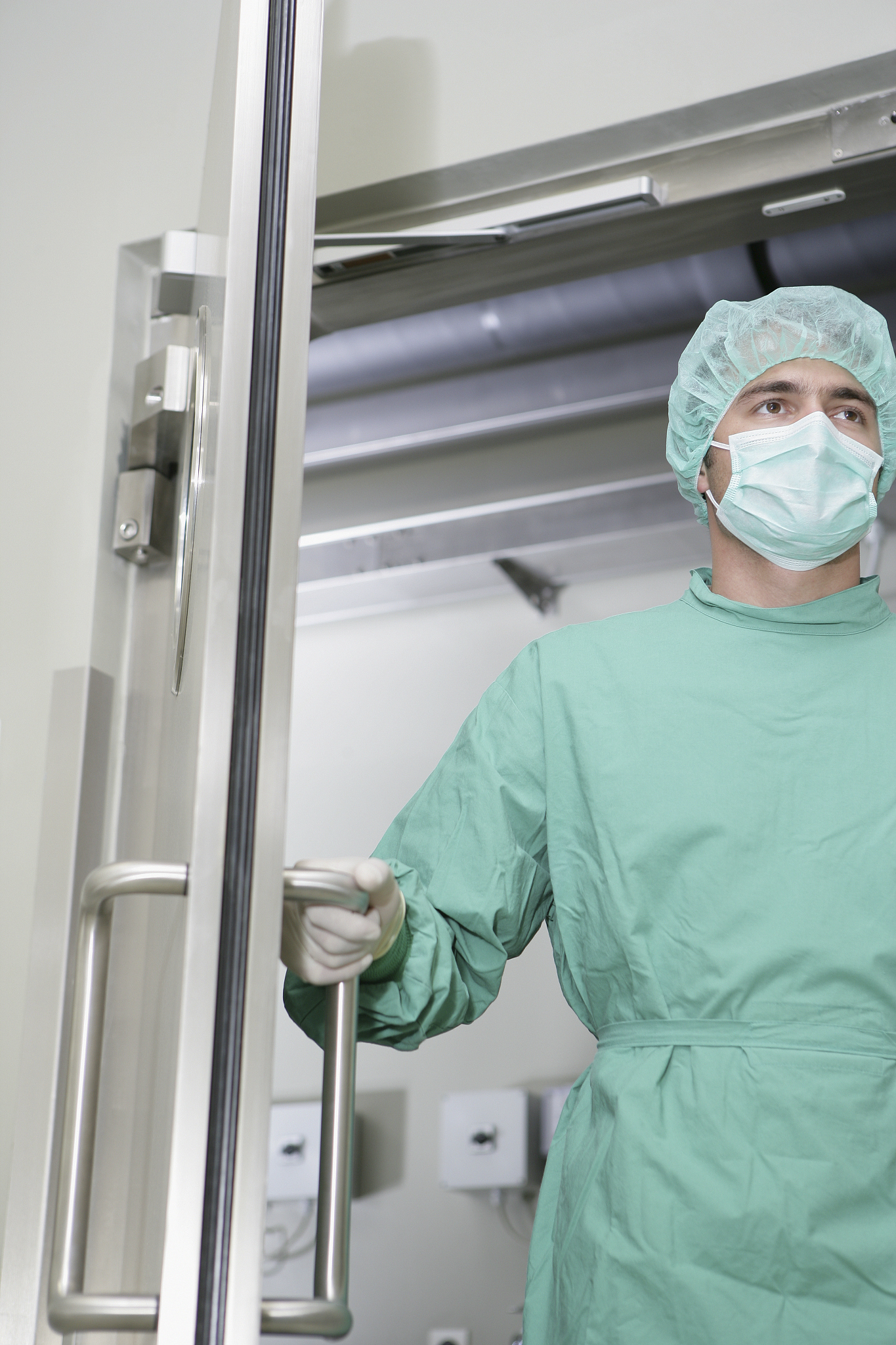 lab employee closing door