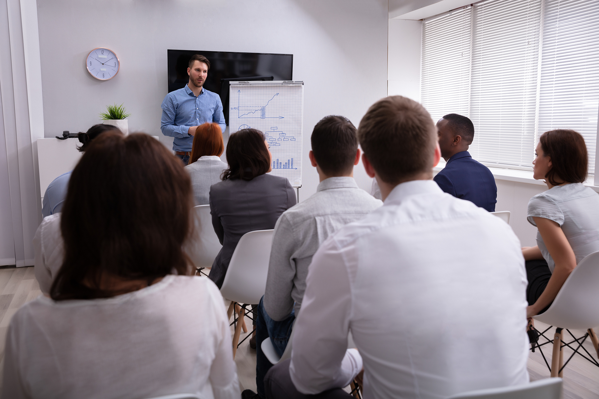 businessman giving presentation to his colleagues