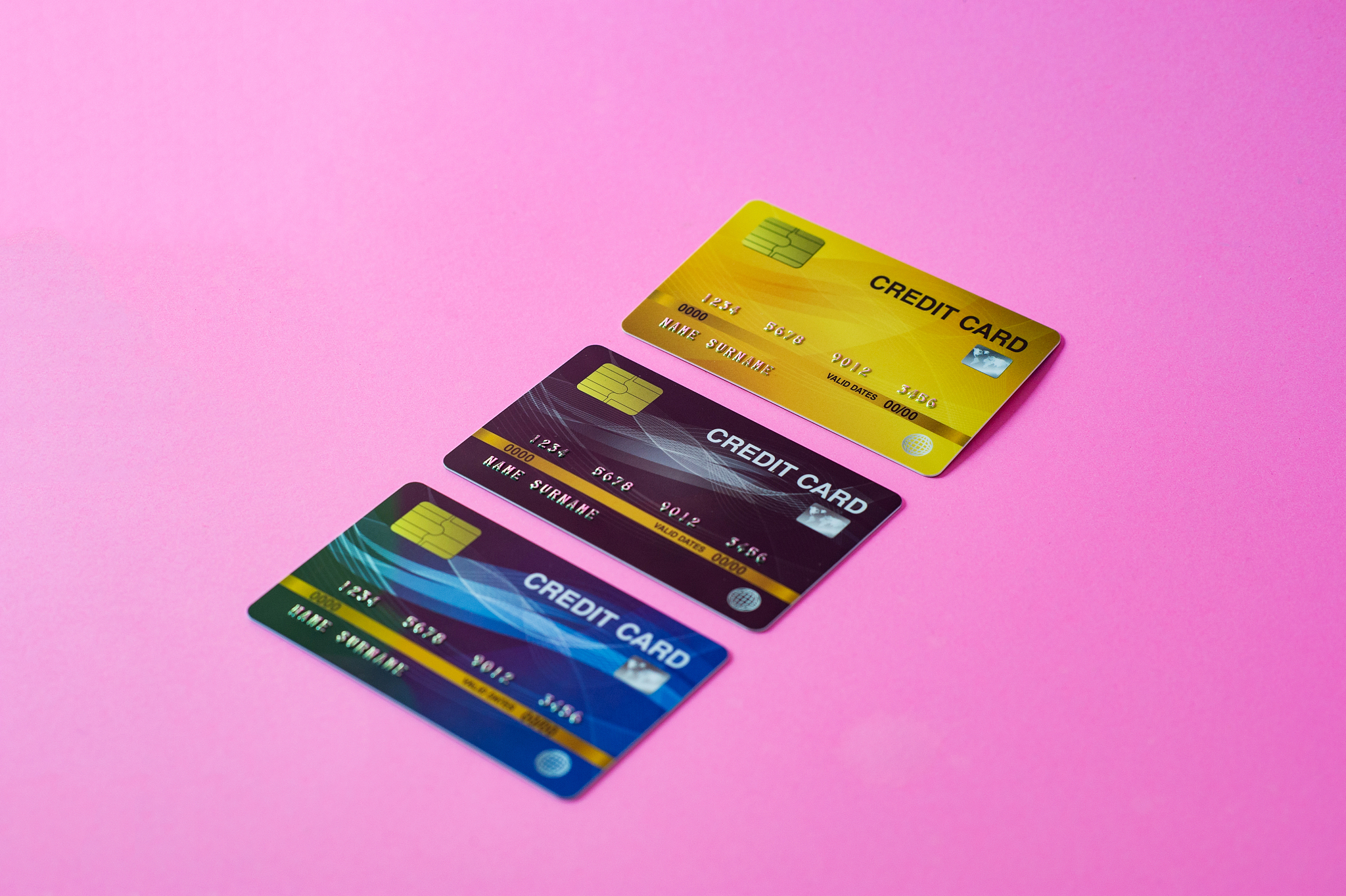 credit card on pink background