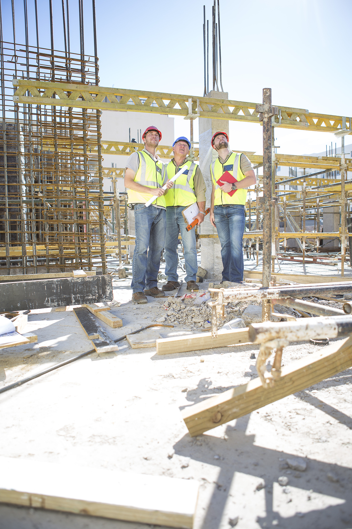 three construction workers in construction site