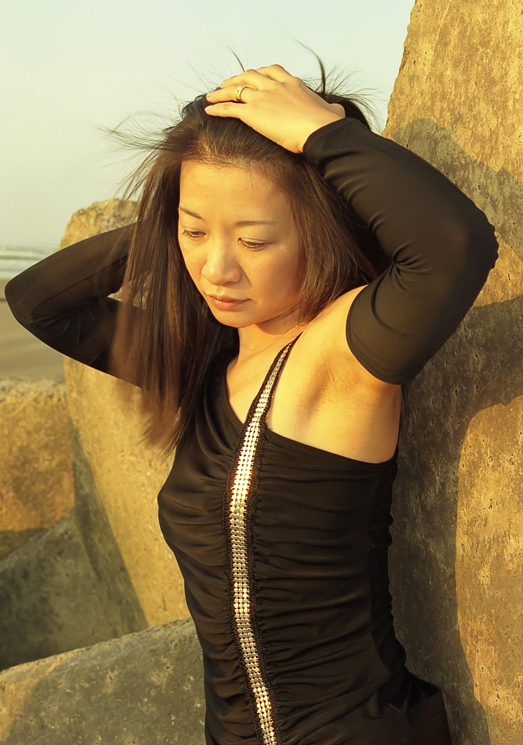 close-up of woman standing against rock