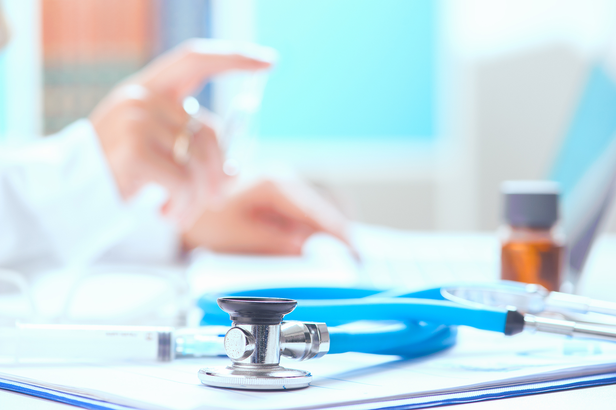 stethoscope and doctor hand showing medicine