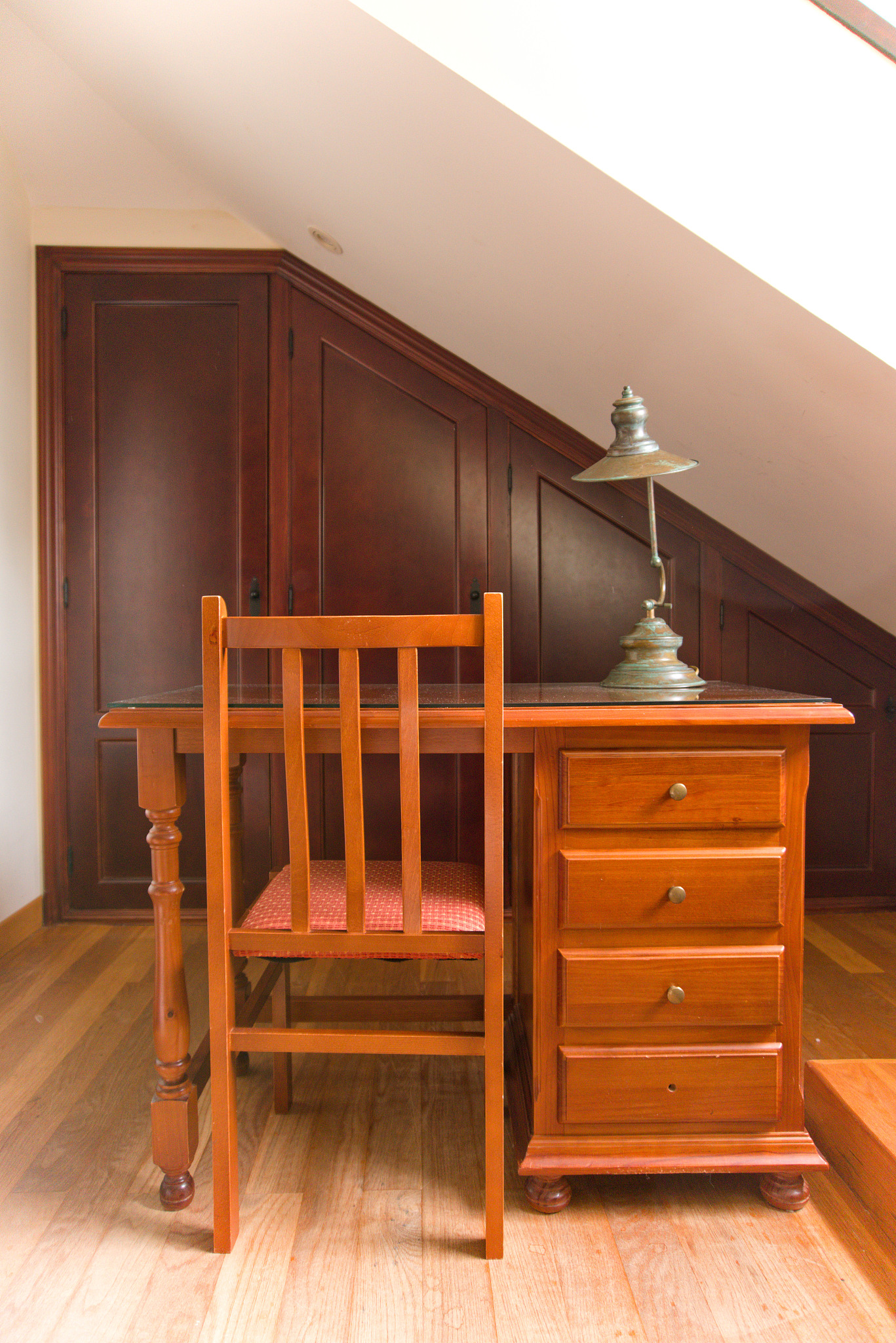 vintage hazel office desk with a chair and a vintage lamp