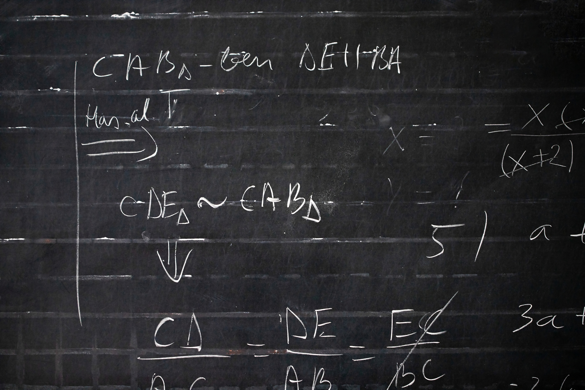 maths formulas written by white chalk on the blackboard backgrou