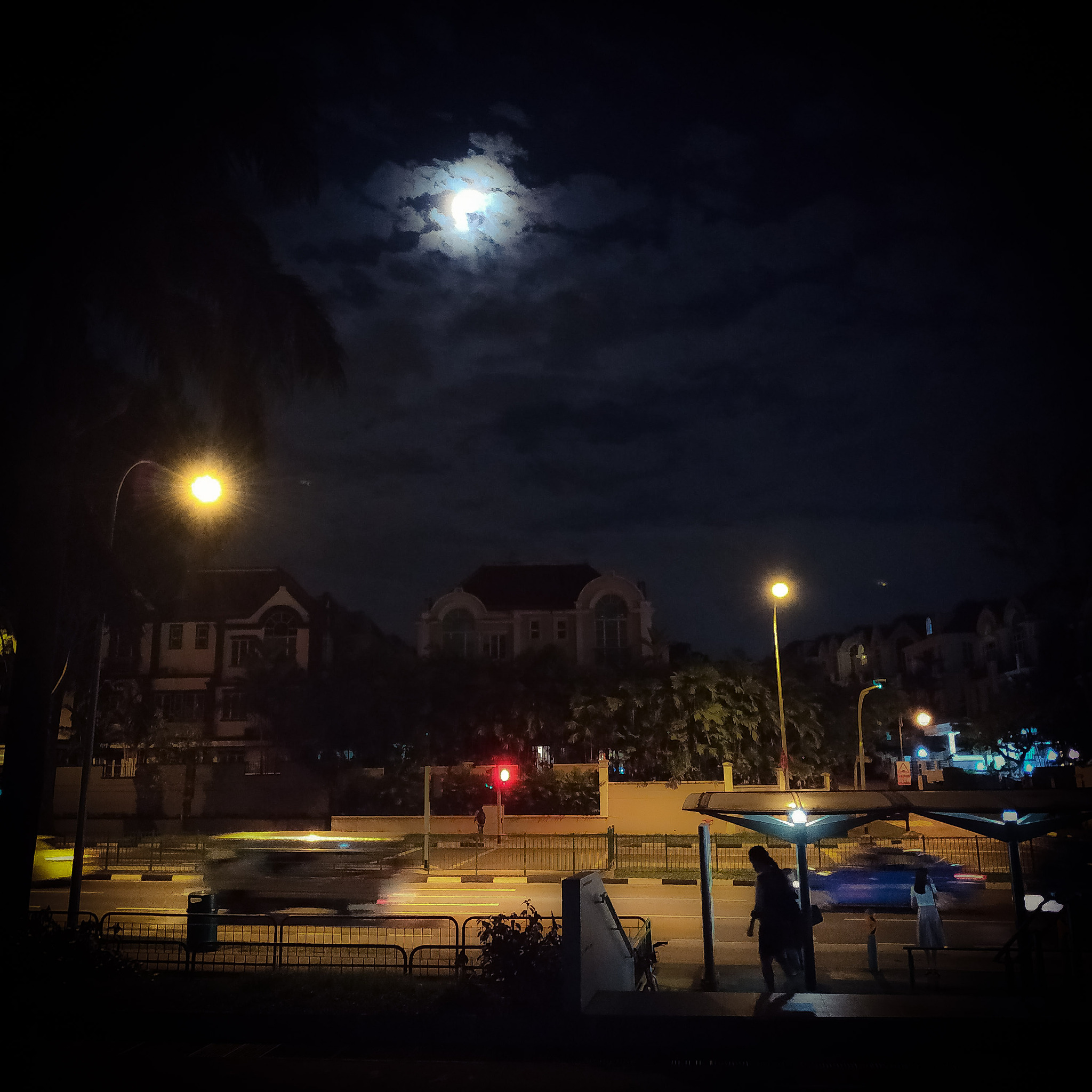 bright moon in a cloudy night sky