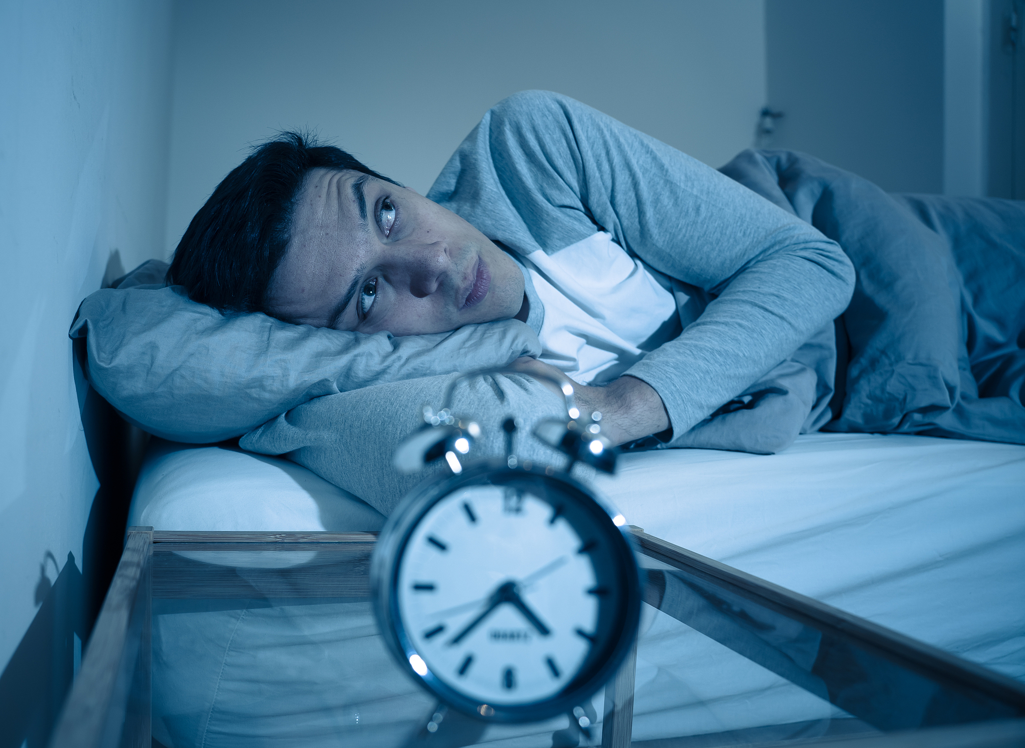 sleepless and desperate young caucasian man awake at night not a