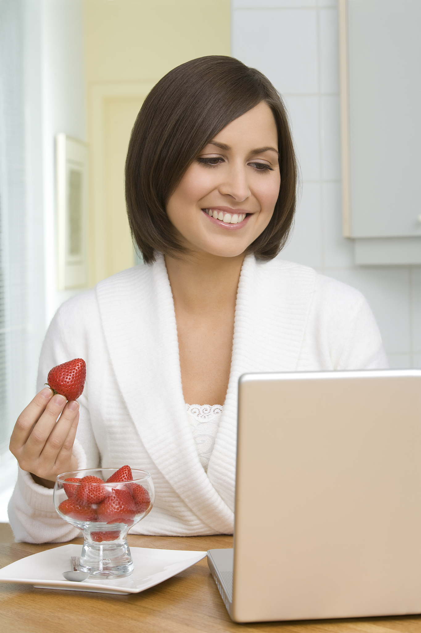 student holding strawberries