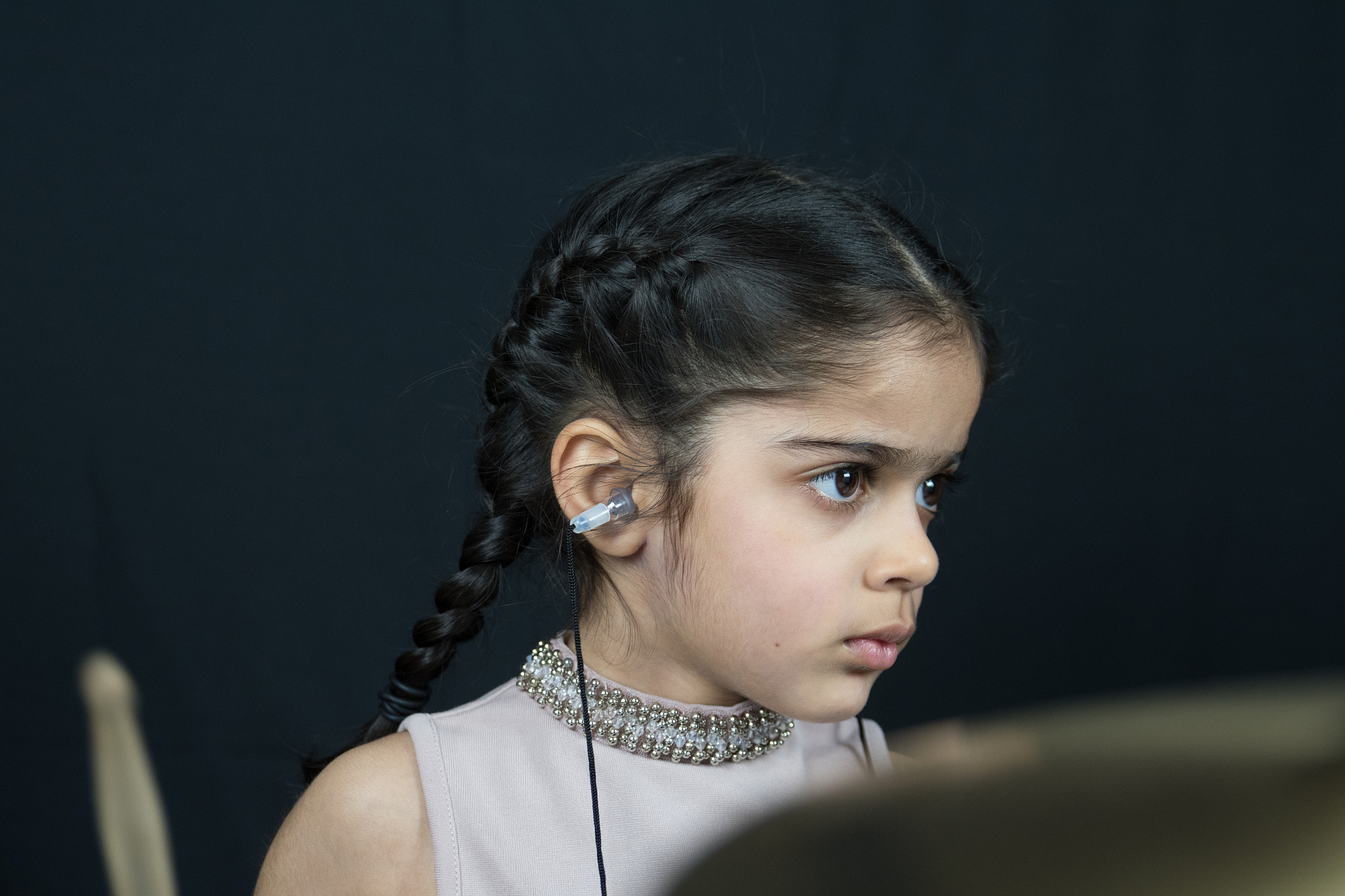 5 year old girl practices the drums