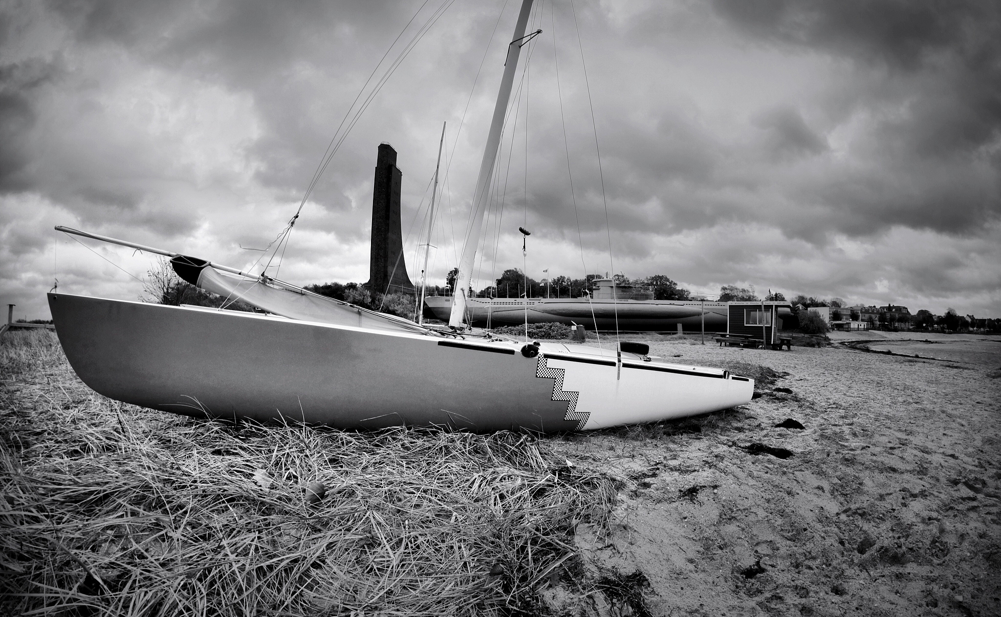 sailboats moored on sea against sky
