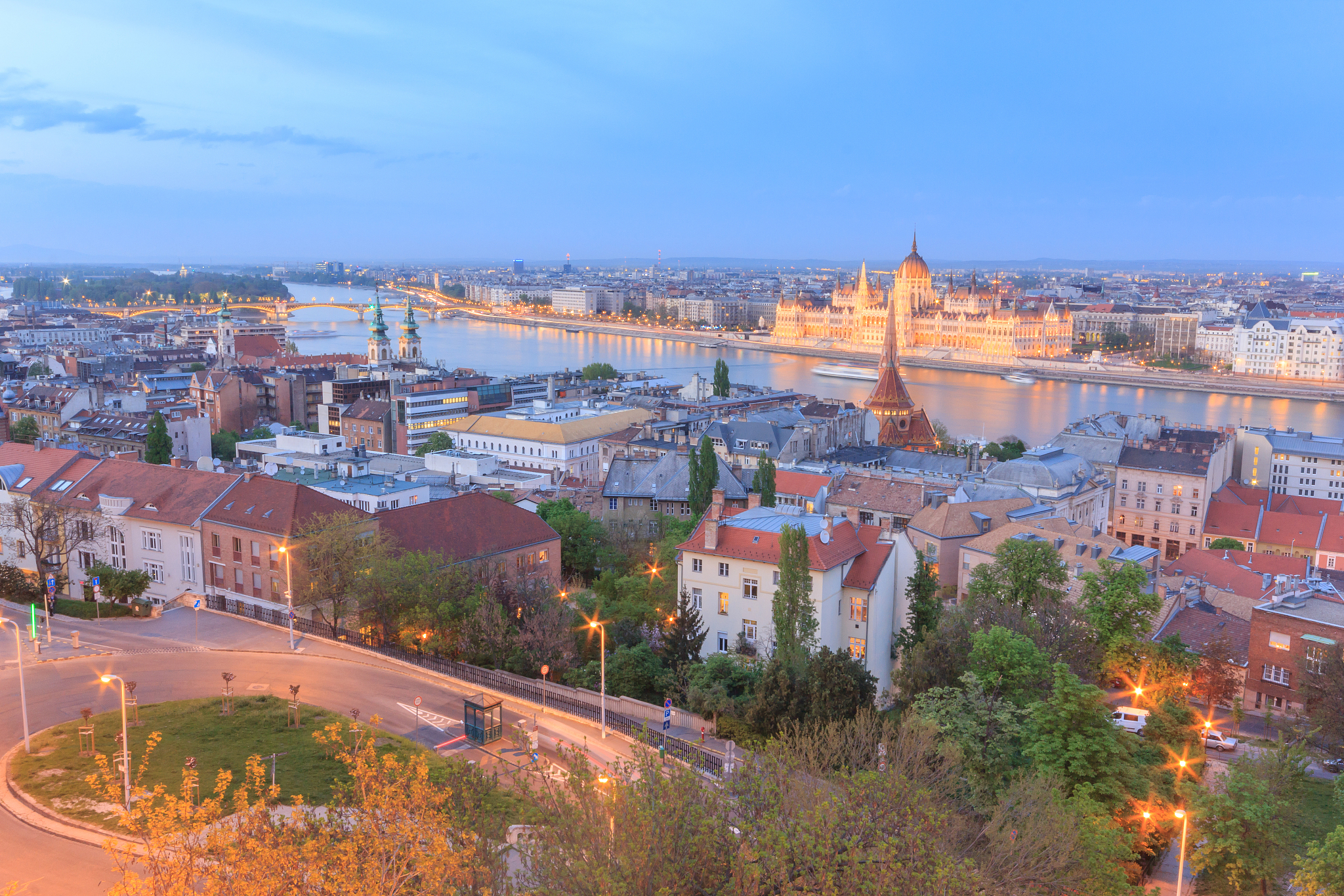 hungarian parliament building by danube river in city against sk