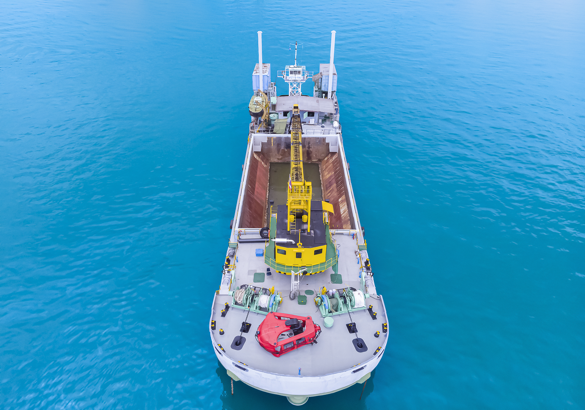 aerial view, ocean liner parked in the middle of the blue sea.