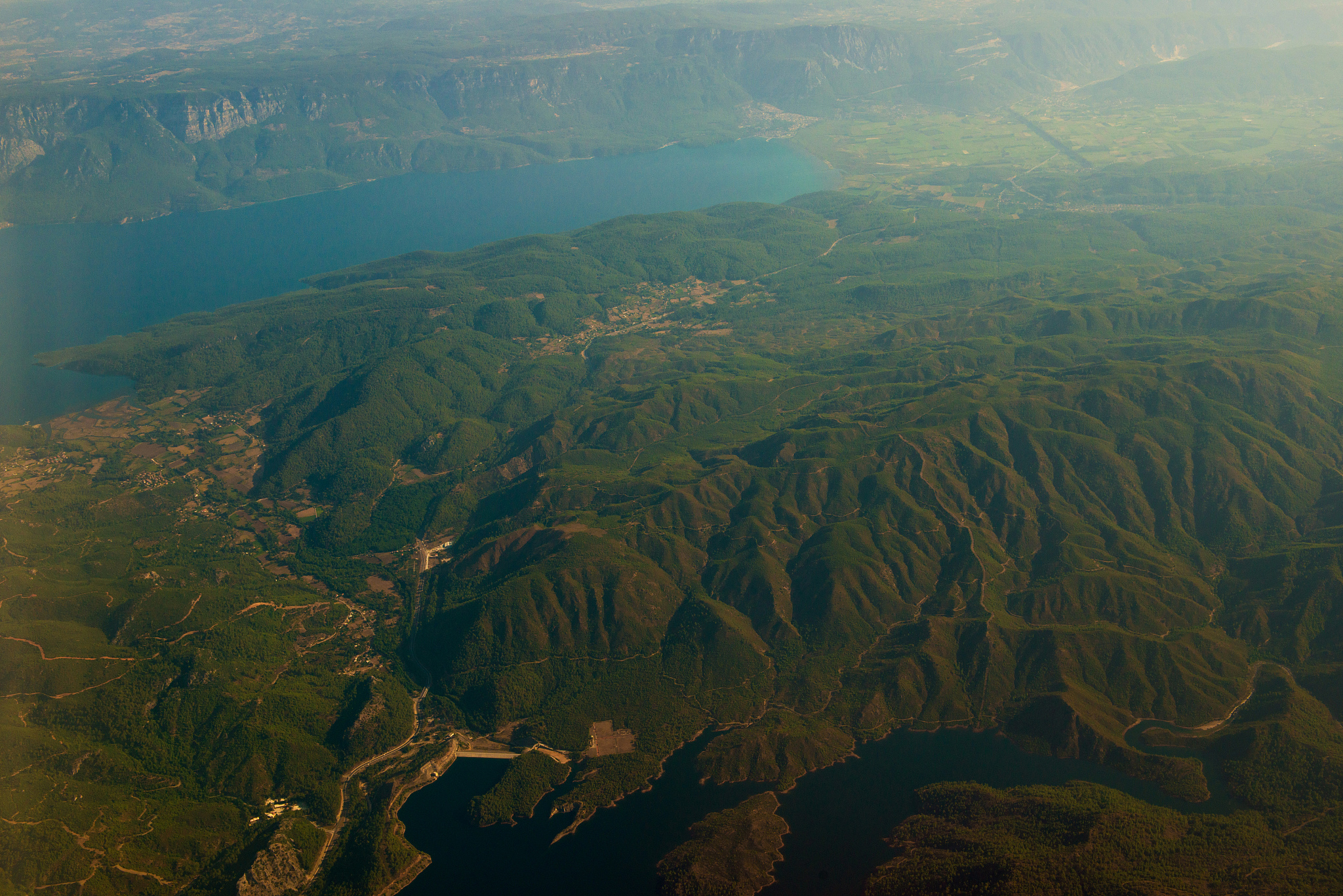 a picturesque landscape with rocky mountains, overgrown with den