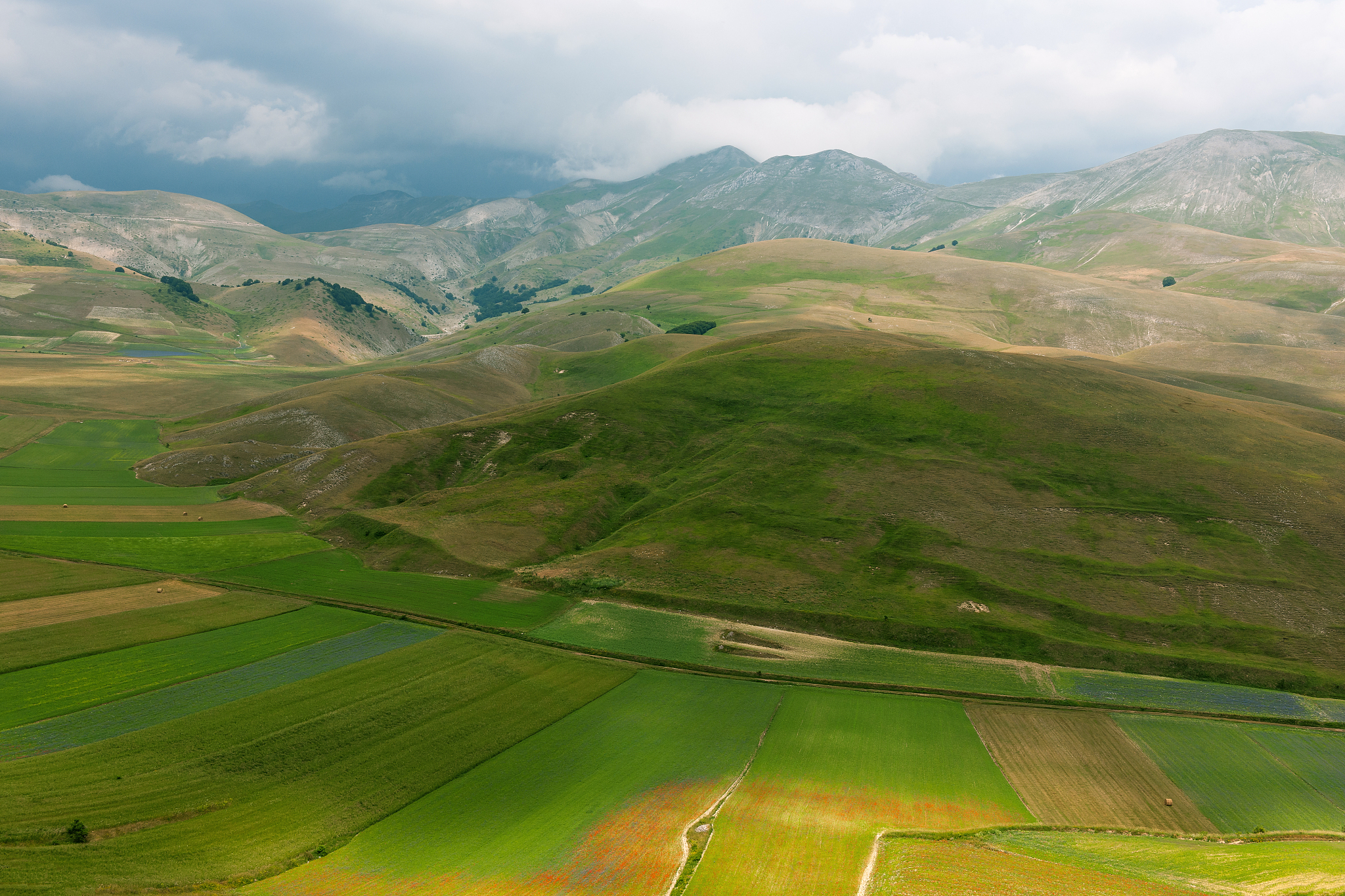 castelluccio di norcia (italy), village on a green hill
