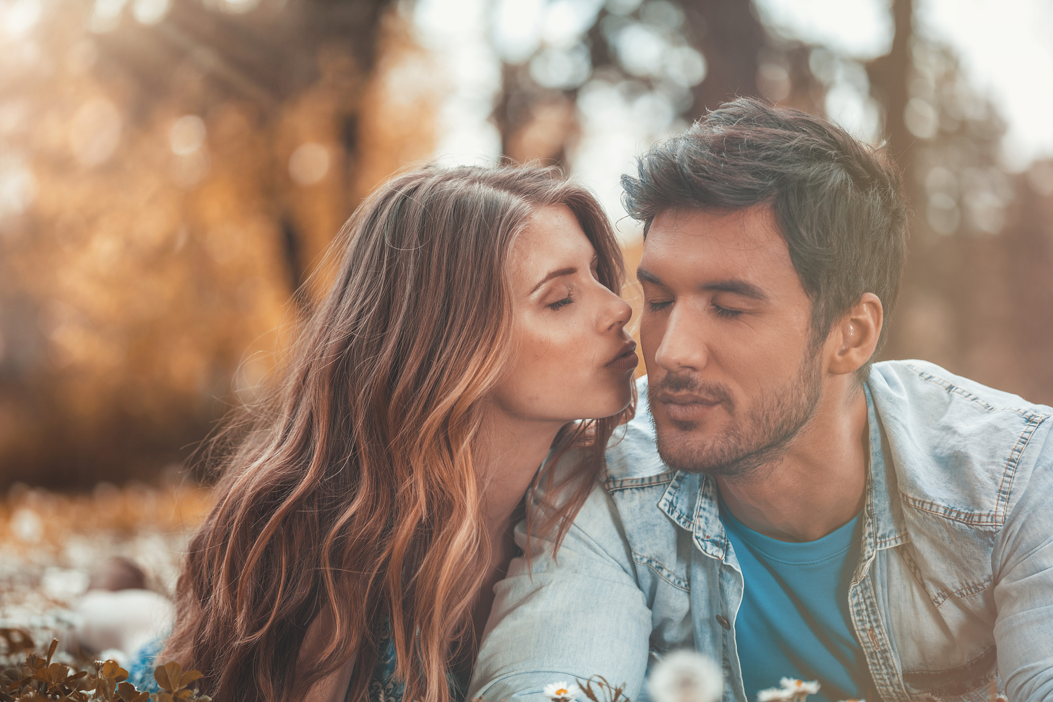 woman kissing man on cheek