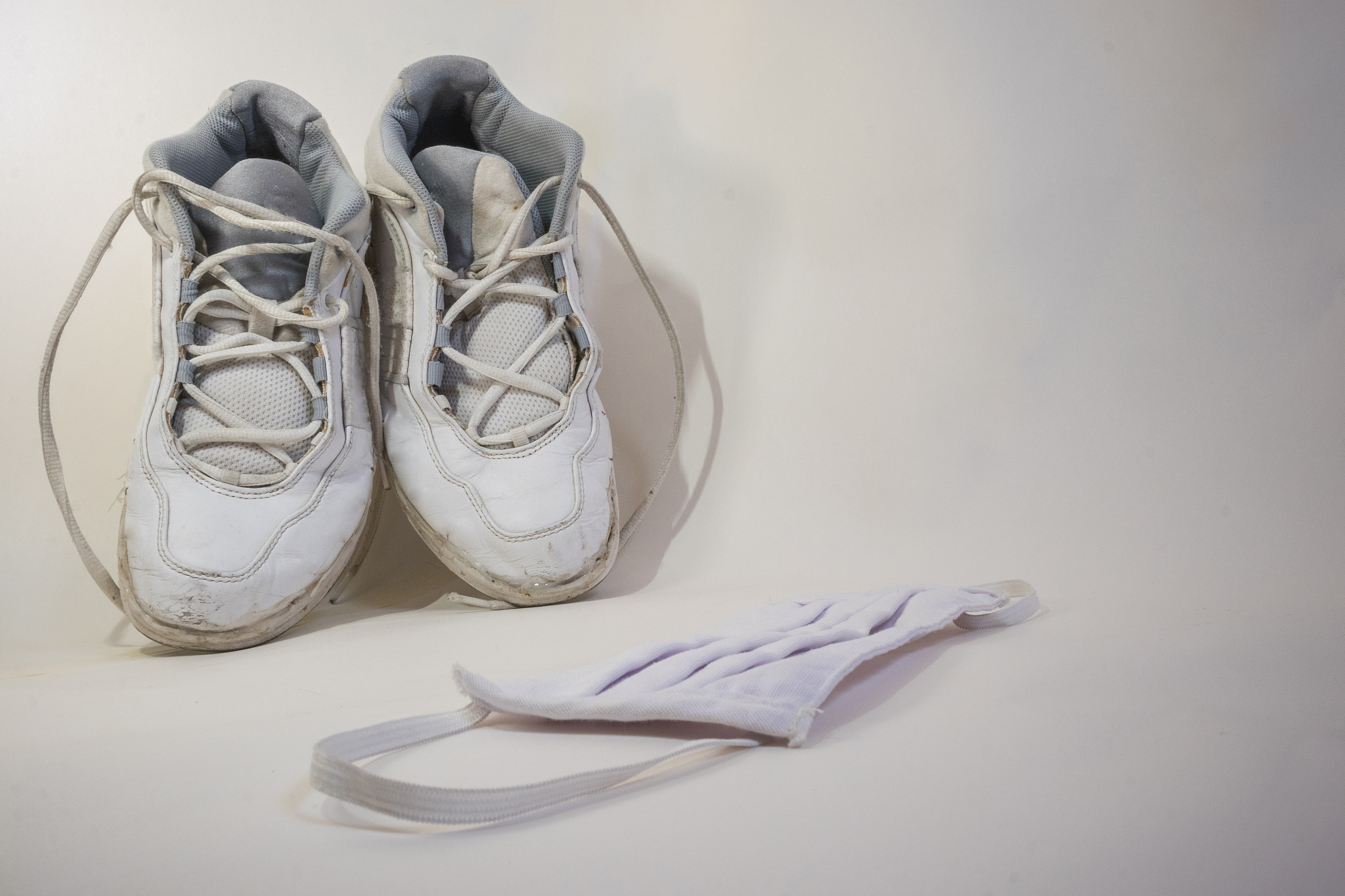 white old shoes and face mask