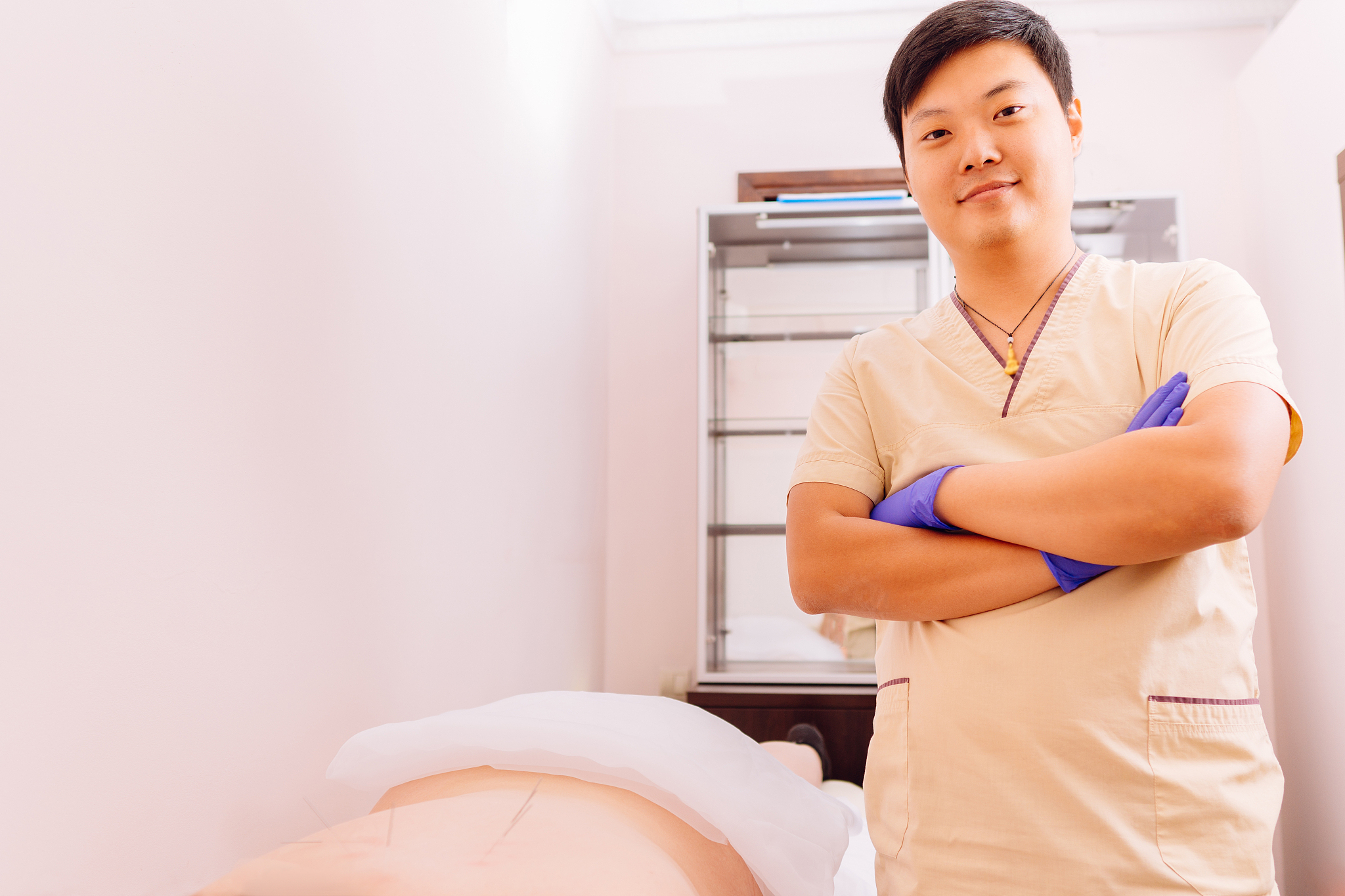 young woman undergoing acupuncture treatment