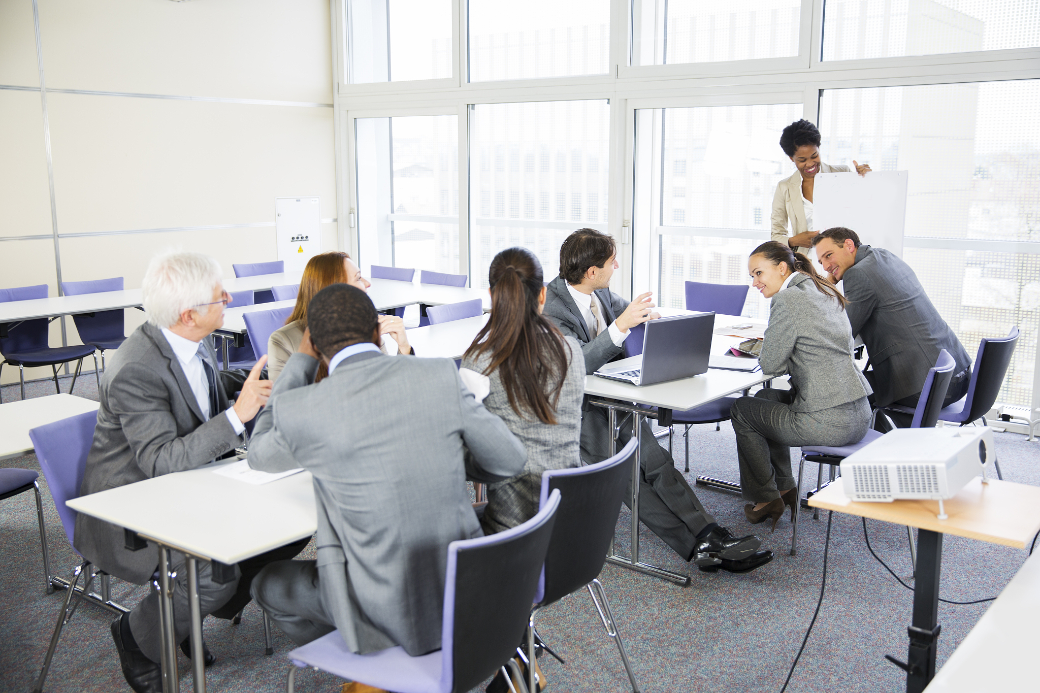 business people listening lecture of a black teacher