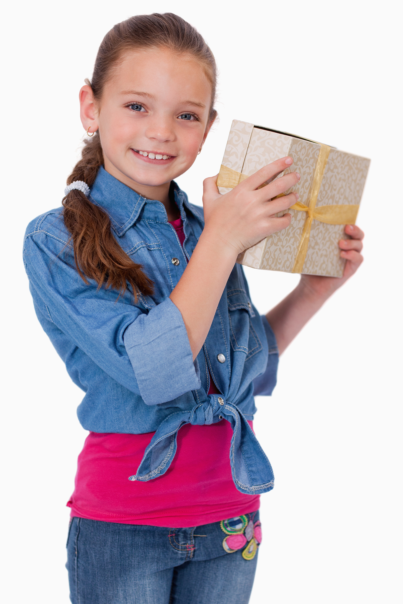 portrait of a happy girl holding a gift box