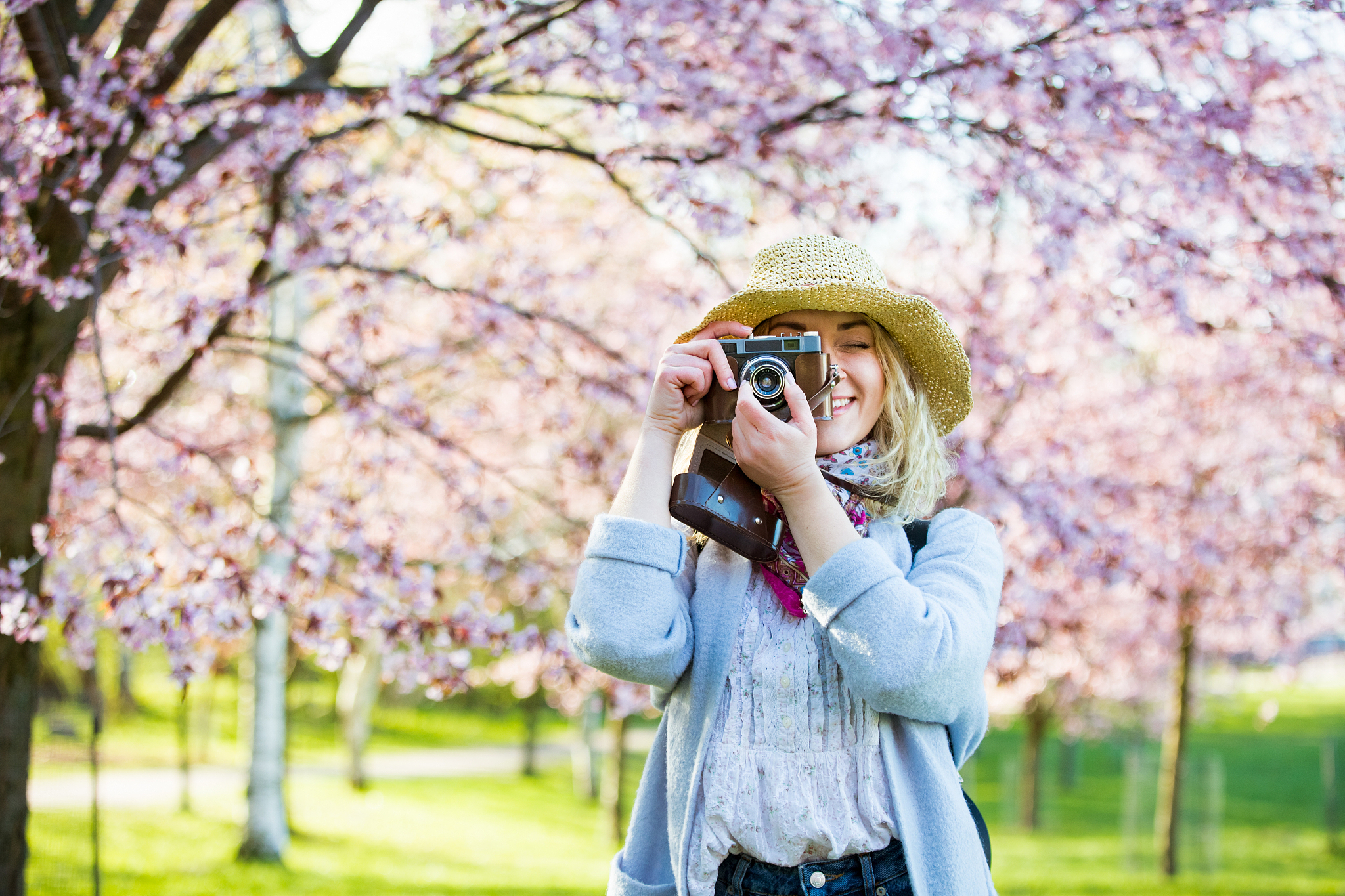 portrait of a beautiful woman in straw hat traveling