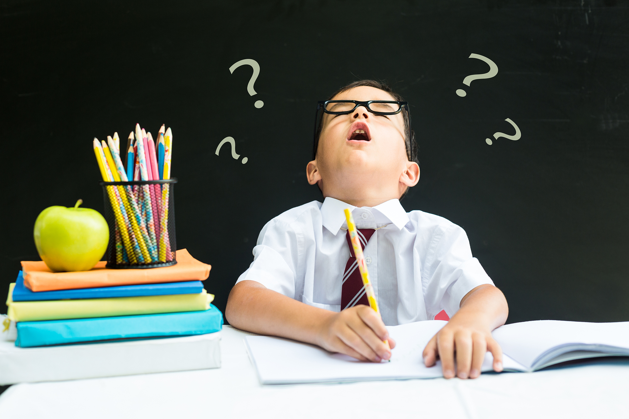young schoolboy upset for making a mistake, solving a hard probl