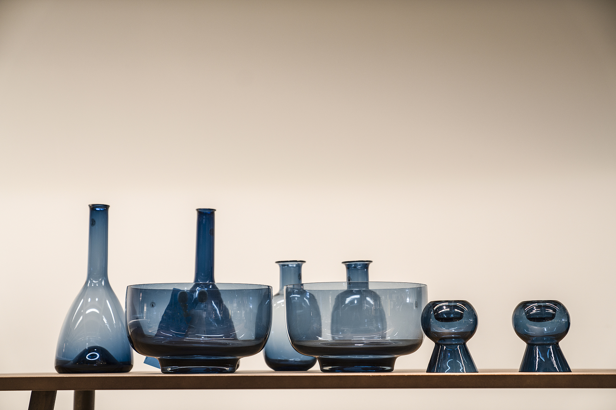 various glass containers against wall