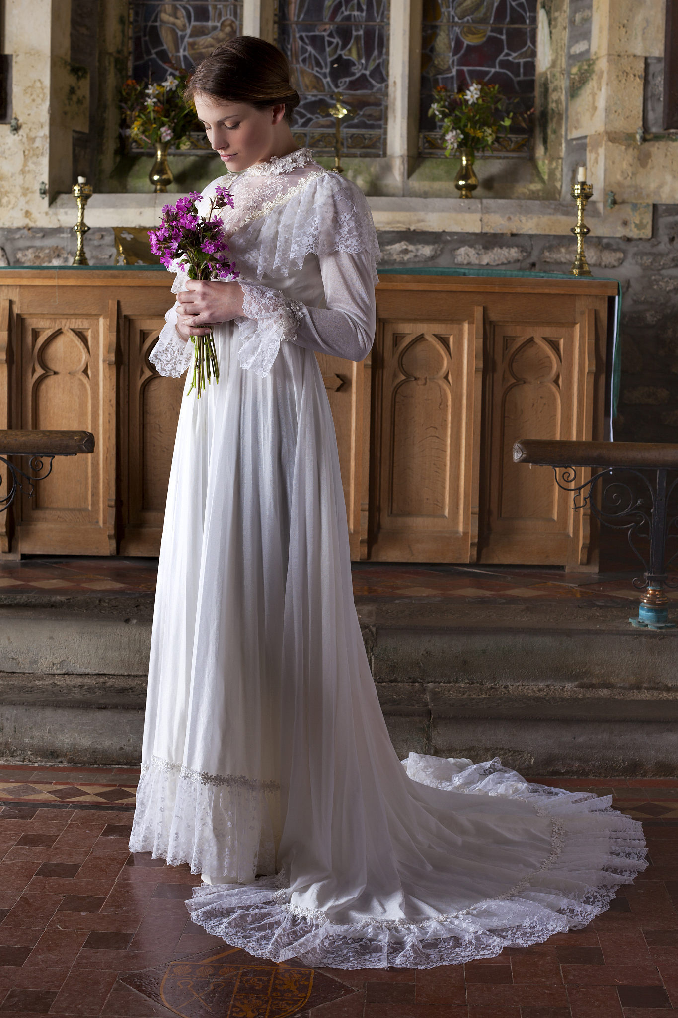 beautiful blushing bride waiting in church