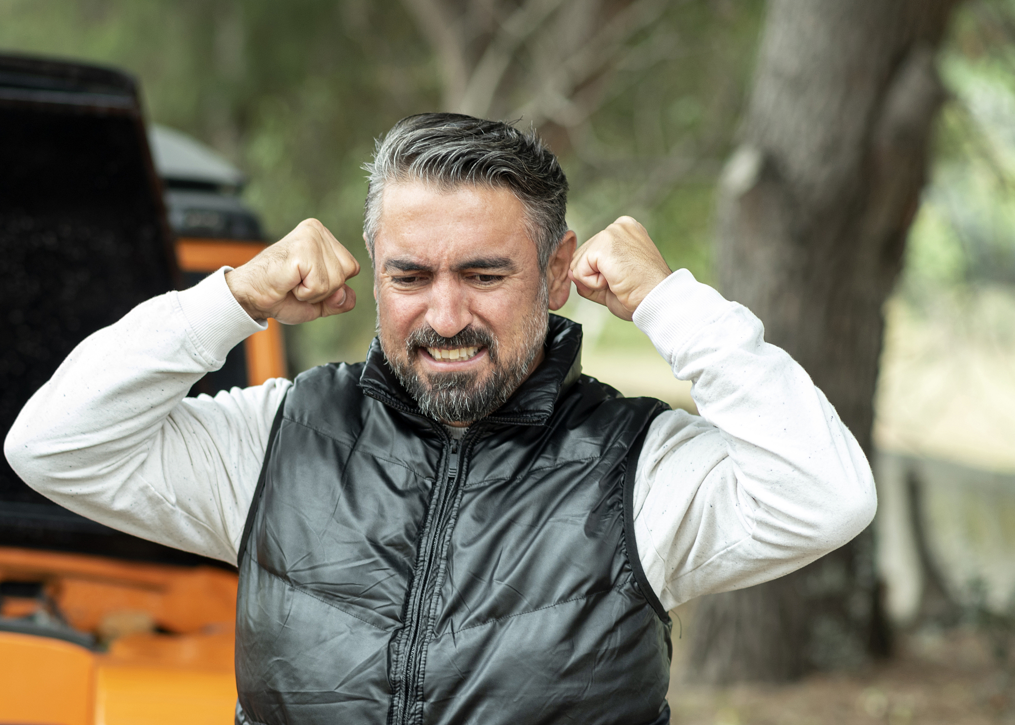 helpless man beside his car