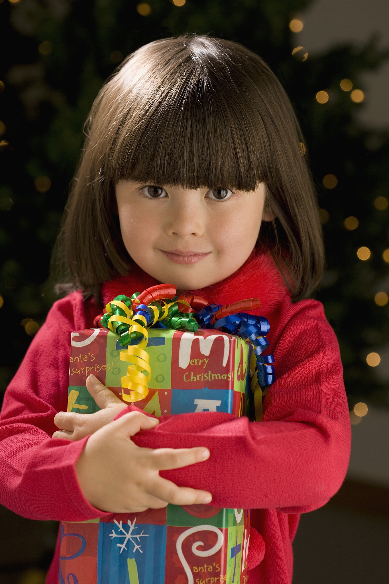 little girl holding present