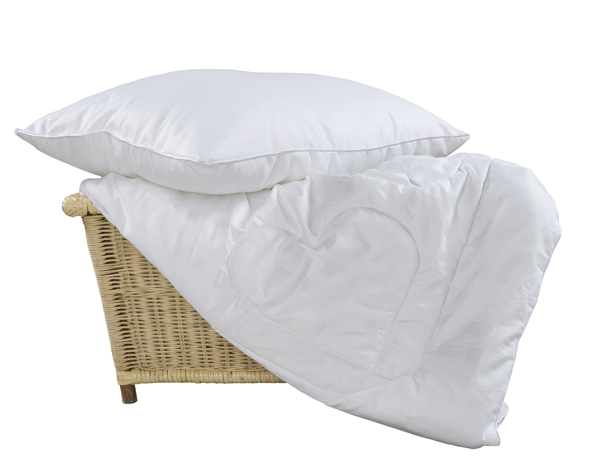 pillow and blanket in wicker basket