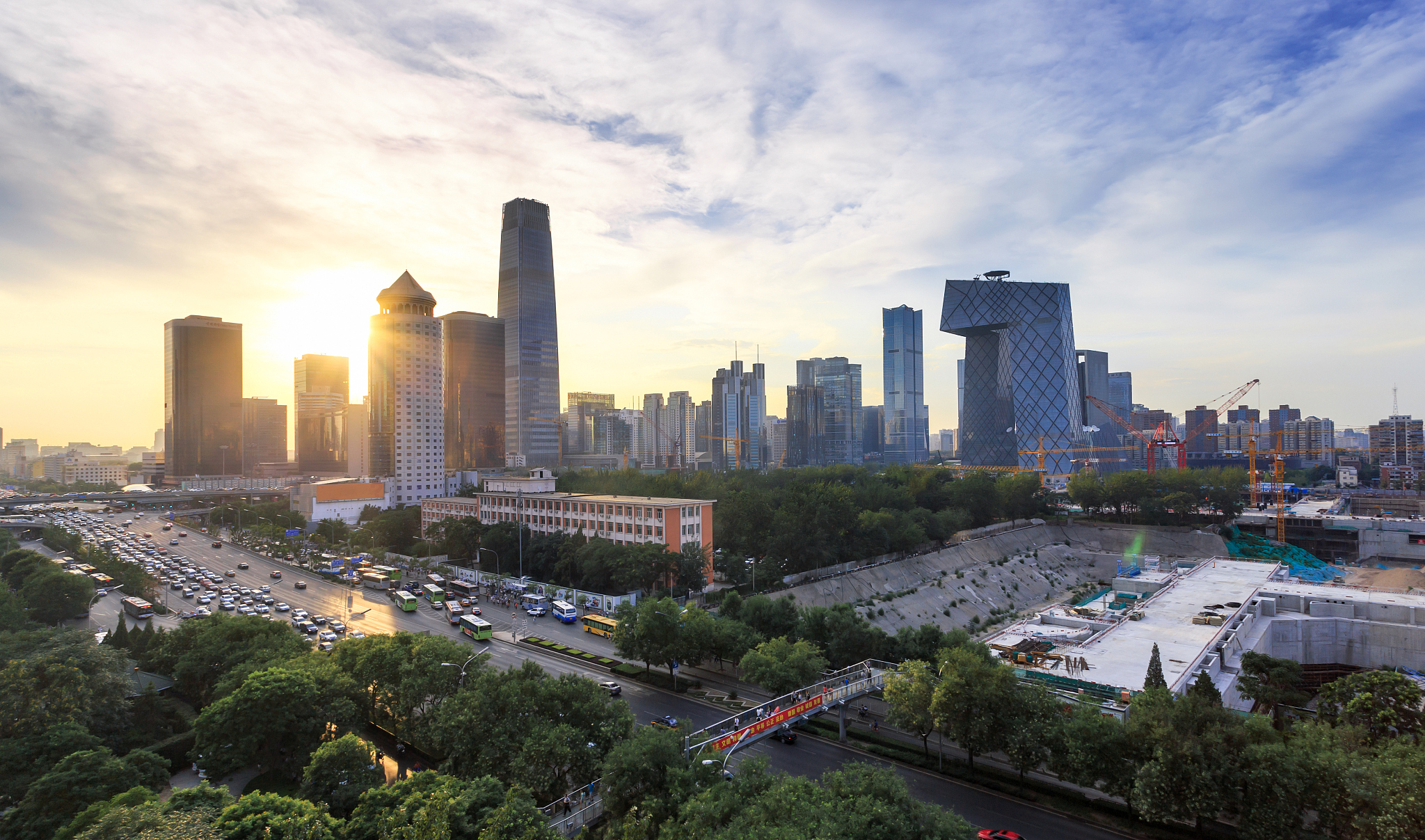 modern buildings in midtown of modern city at sunrise