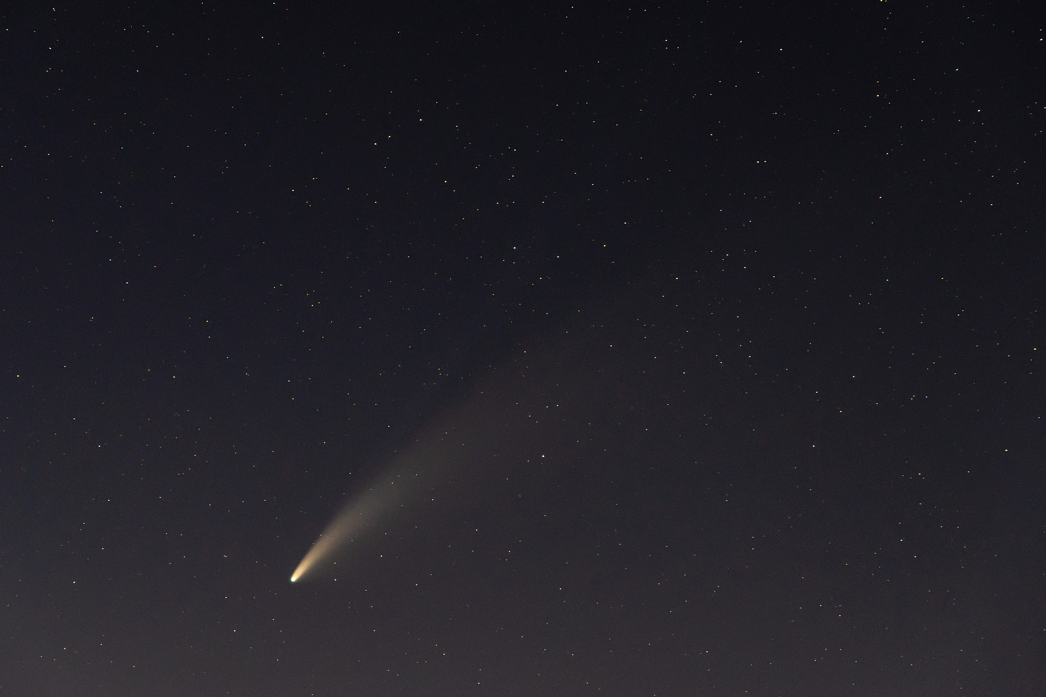 neowise comet and its long dust tail after dusk