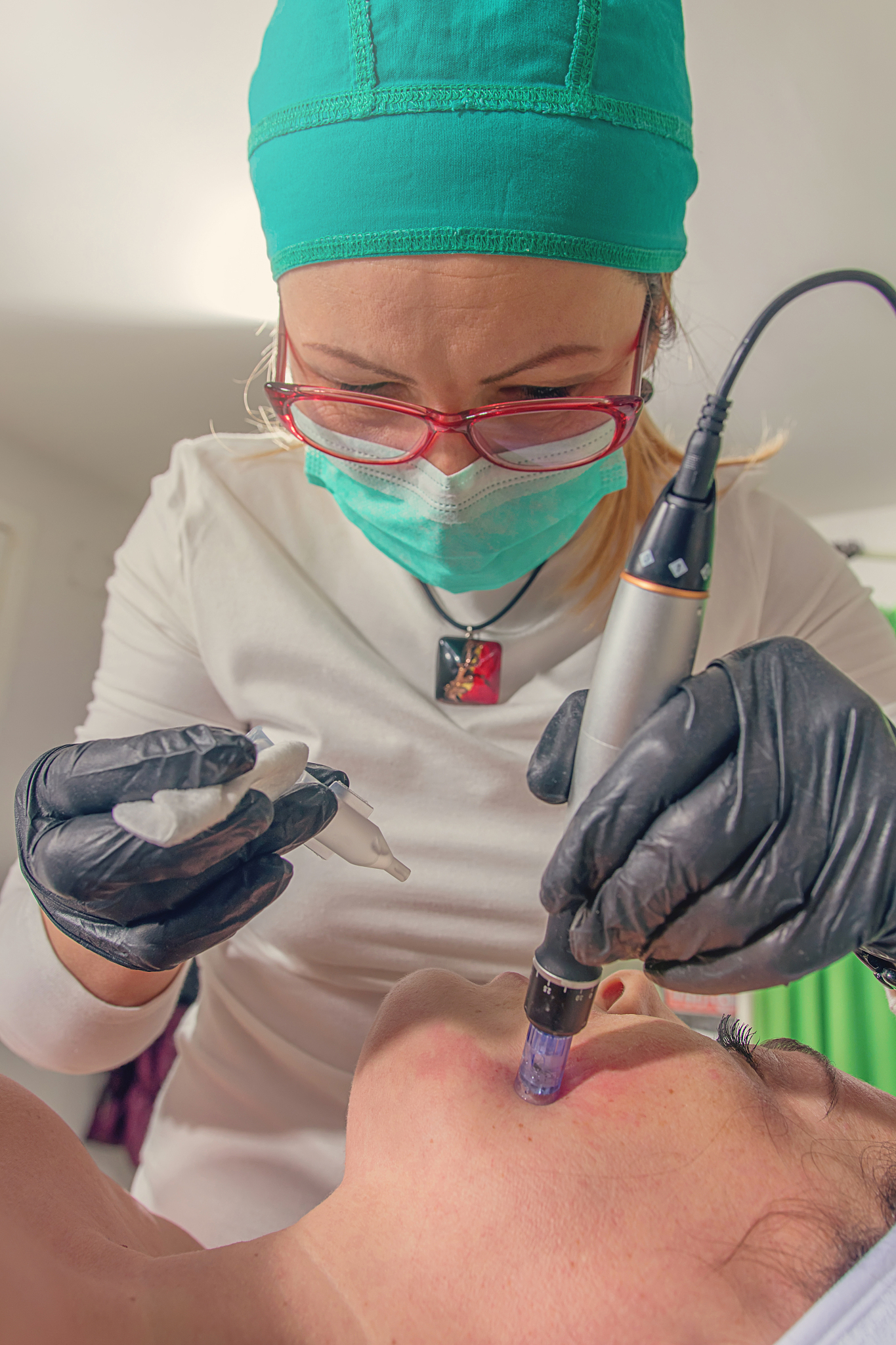 beautician performs a needle mesotherapy treatment on a woman fa