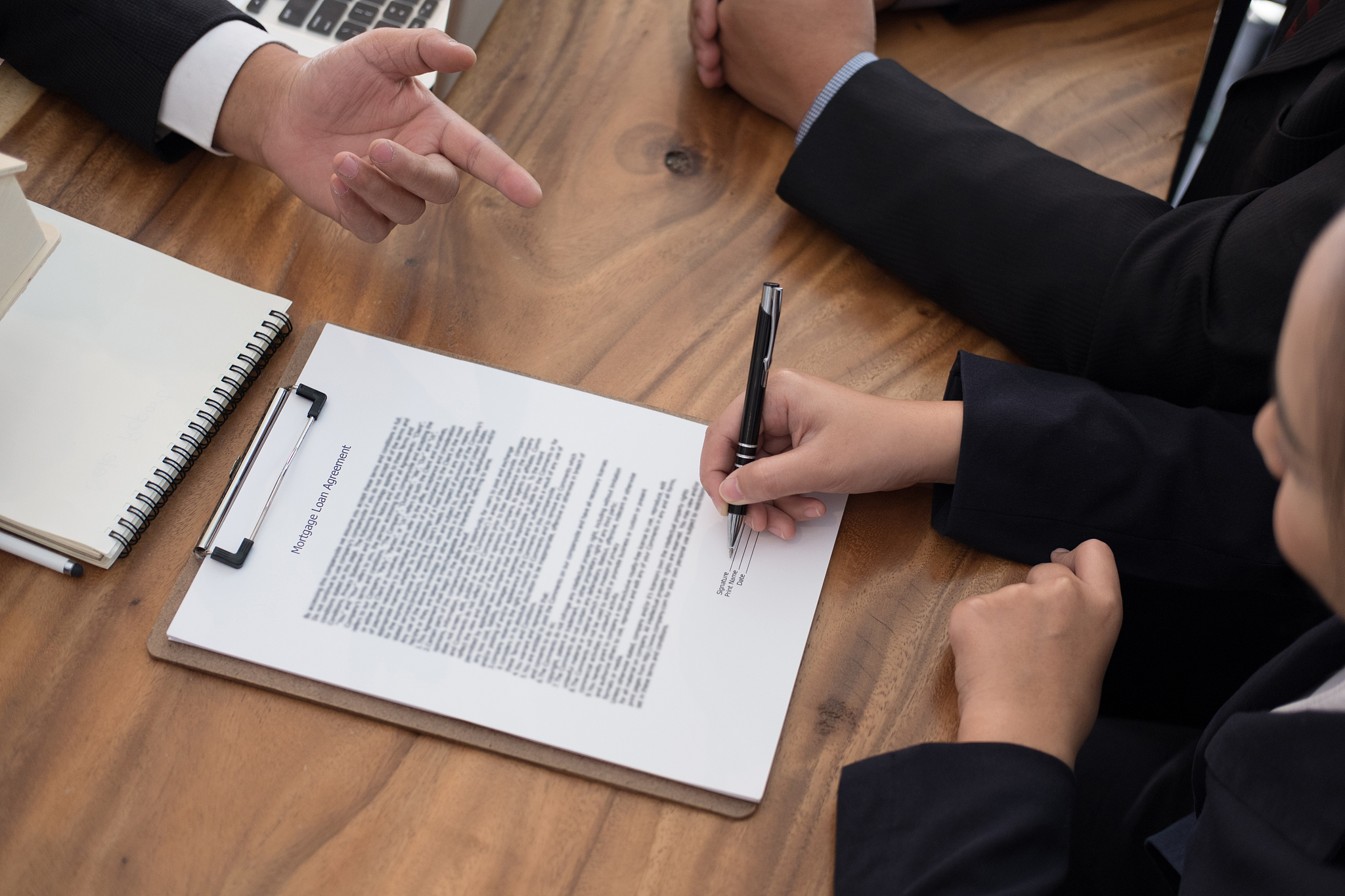 man applying for mortgage loan with bank employee. client signin