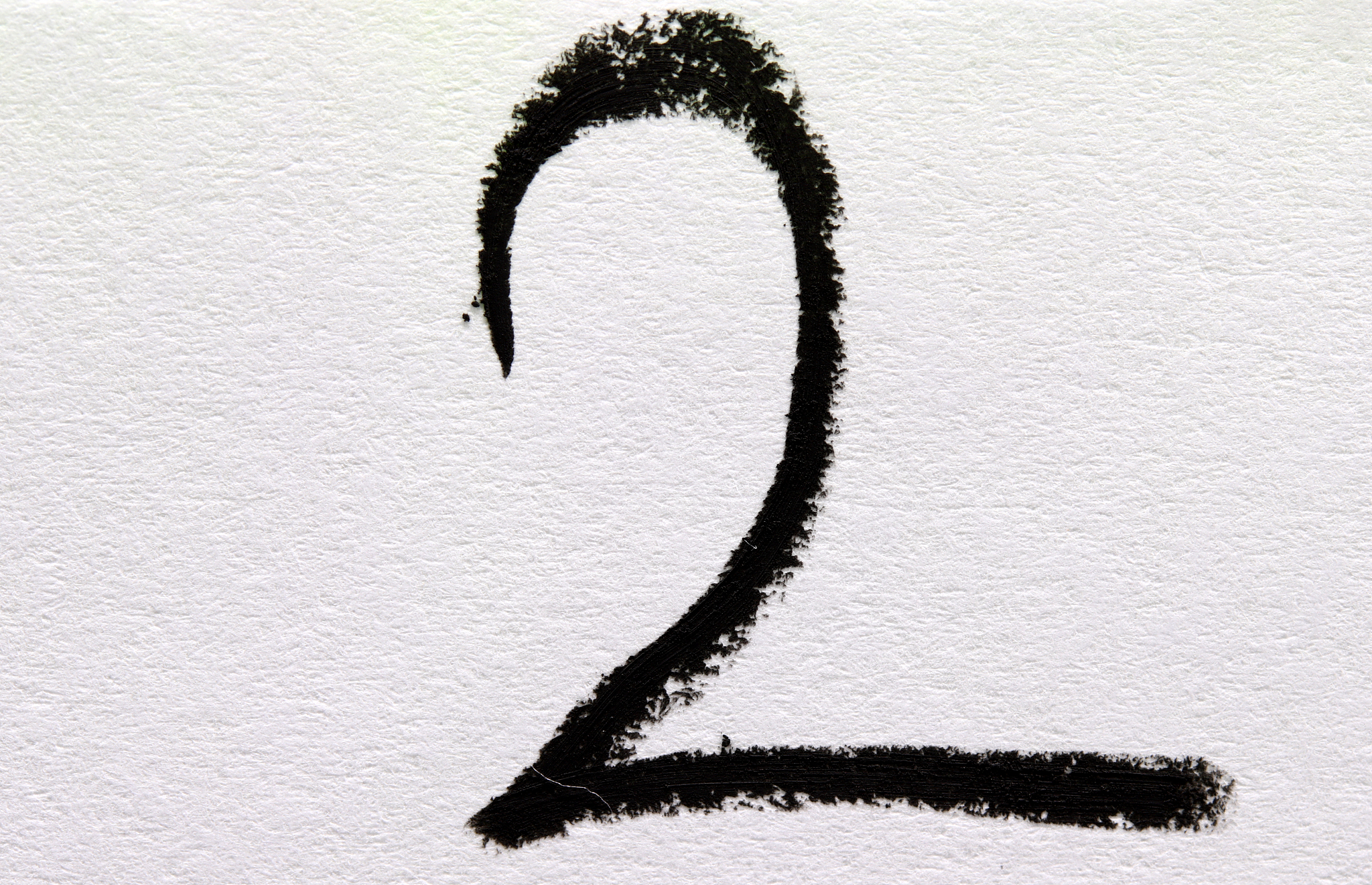 number two made of black and white crayon