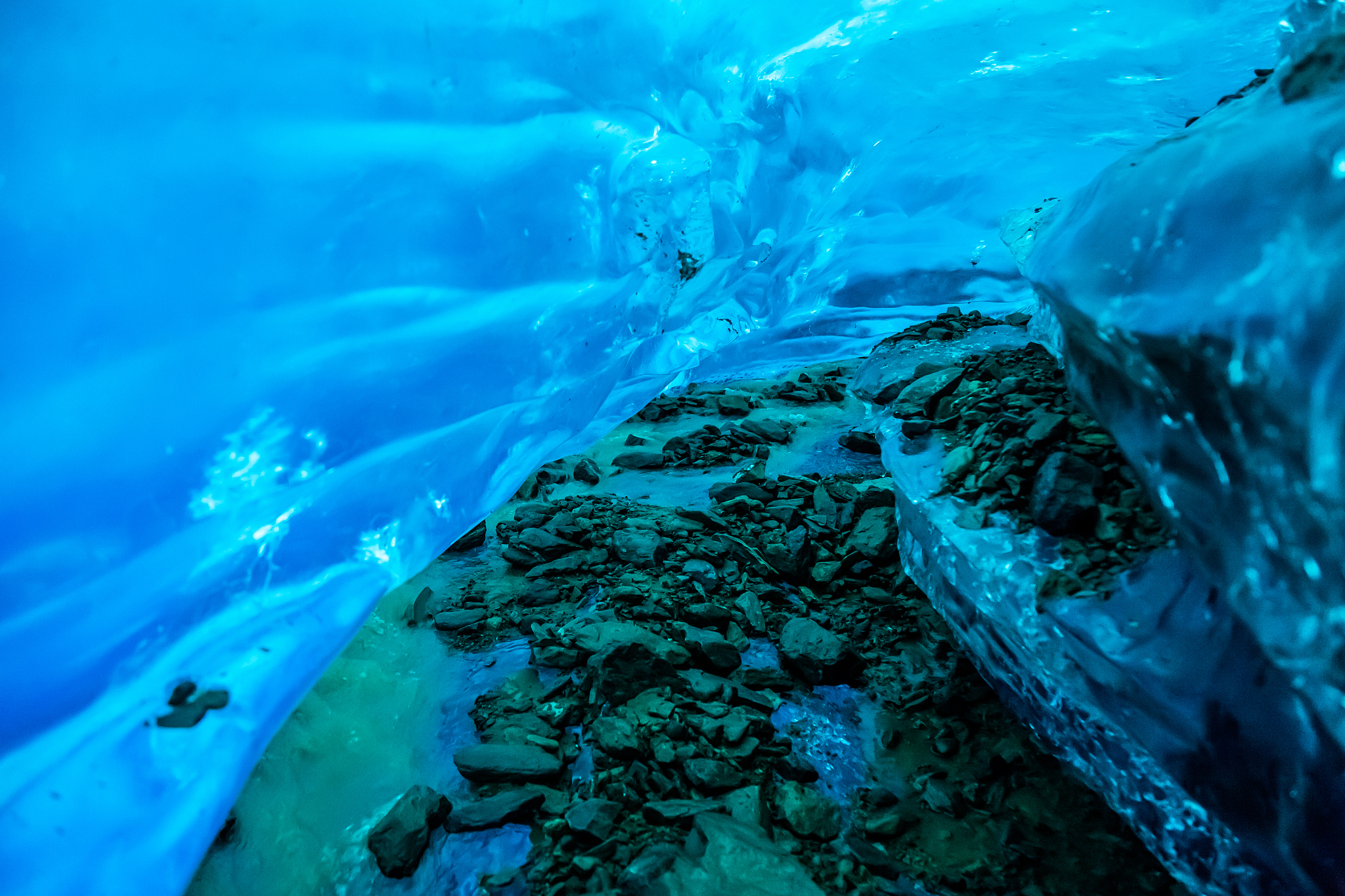 shallow river cutting an ice cave into the salmon glacier in rem