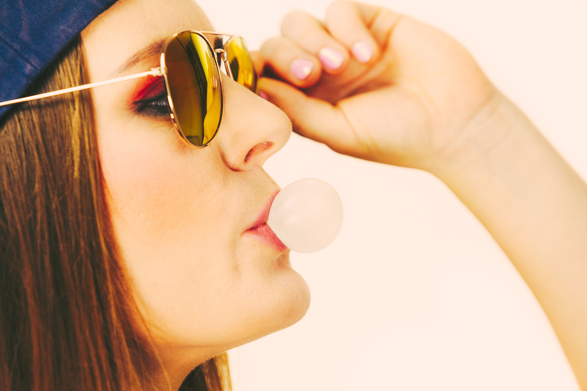 funky girl blowing balloon.