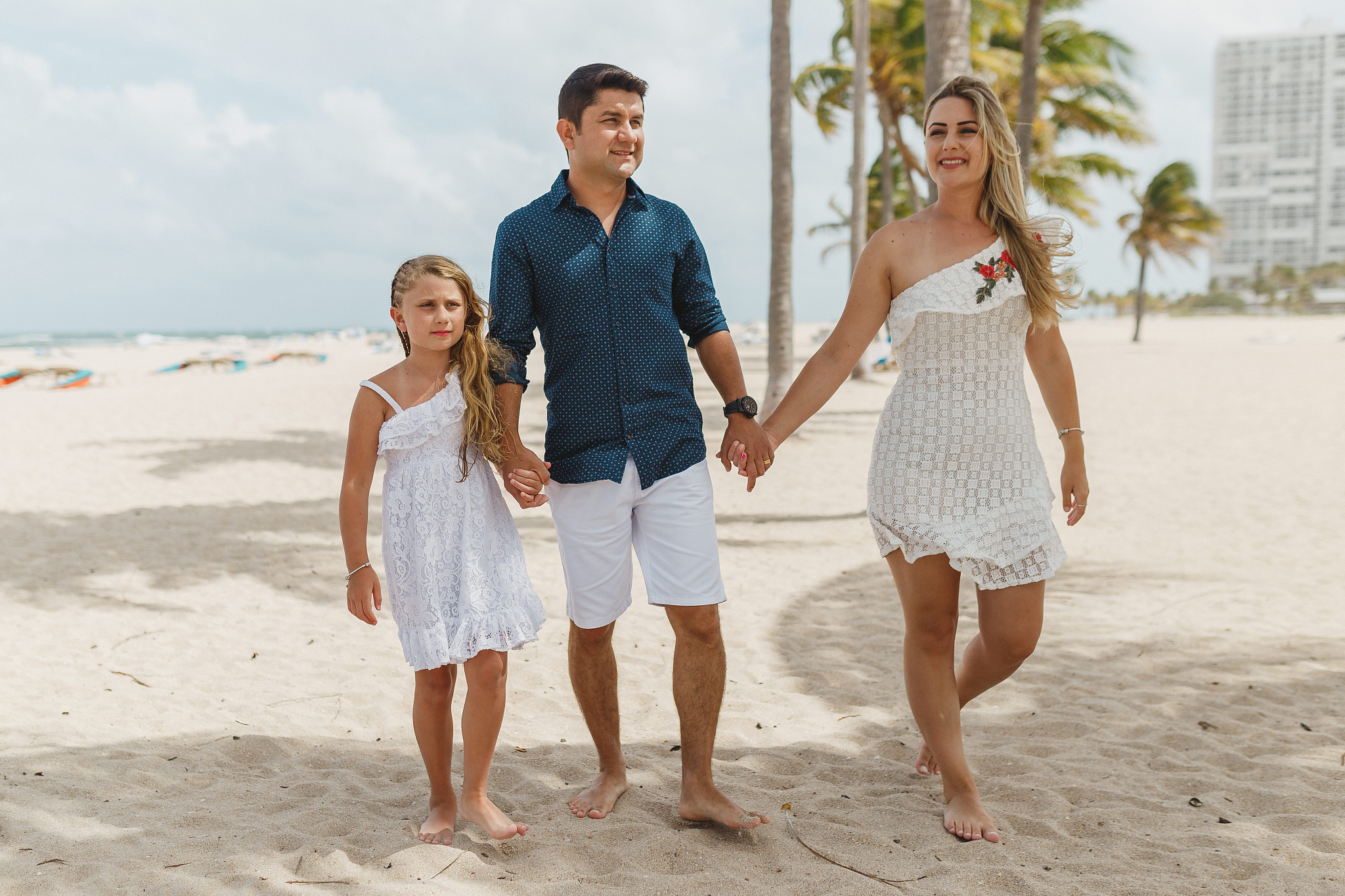 family walking on the beach